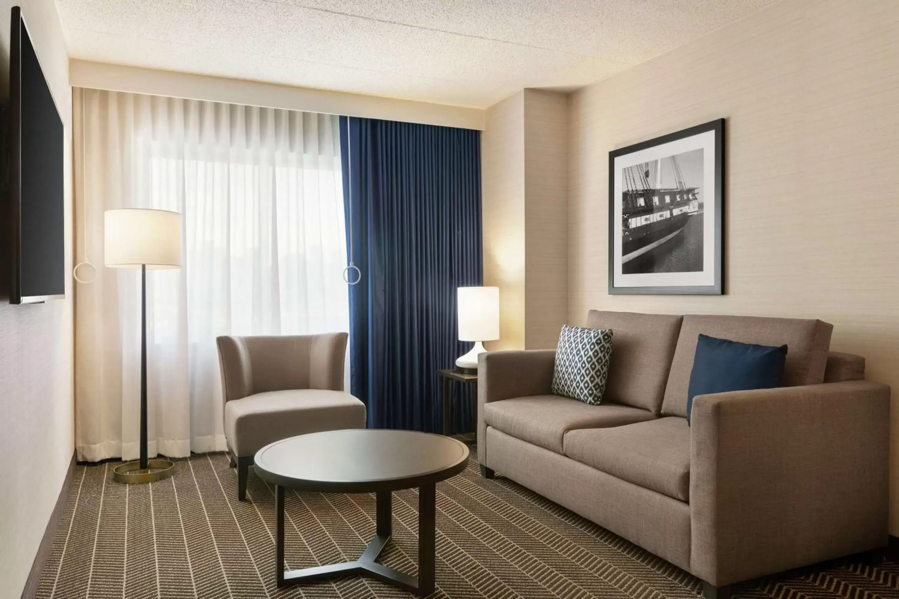 Bedroom, Seating Area in Embassy Suites Boston at Logan Airport