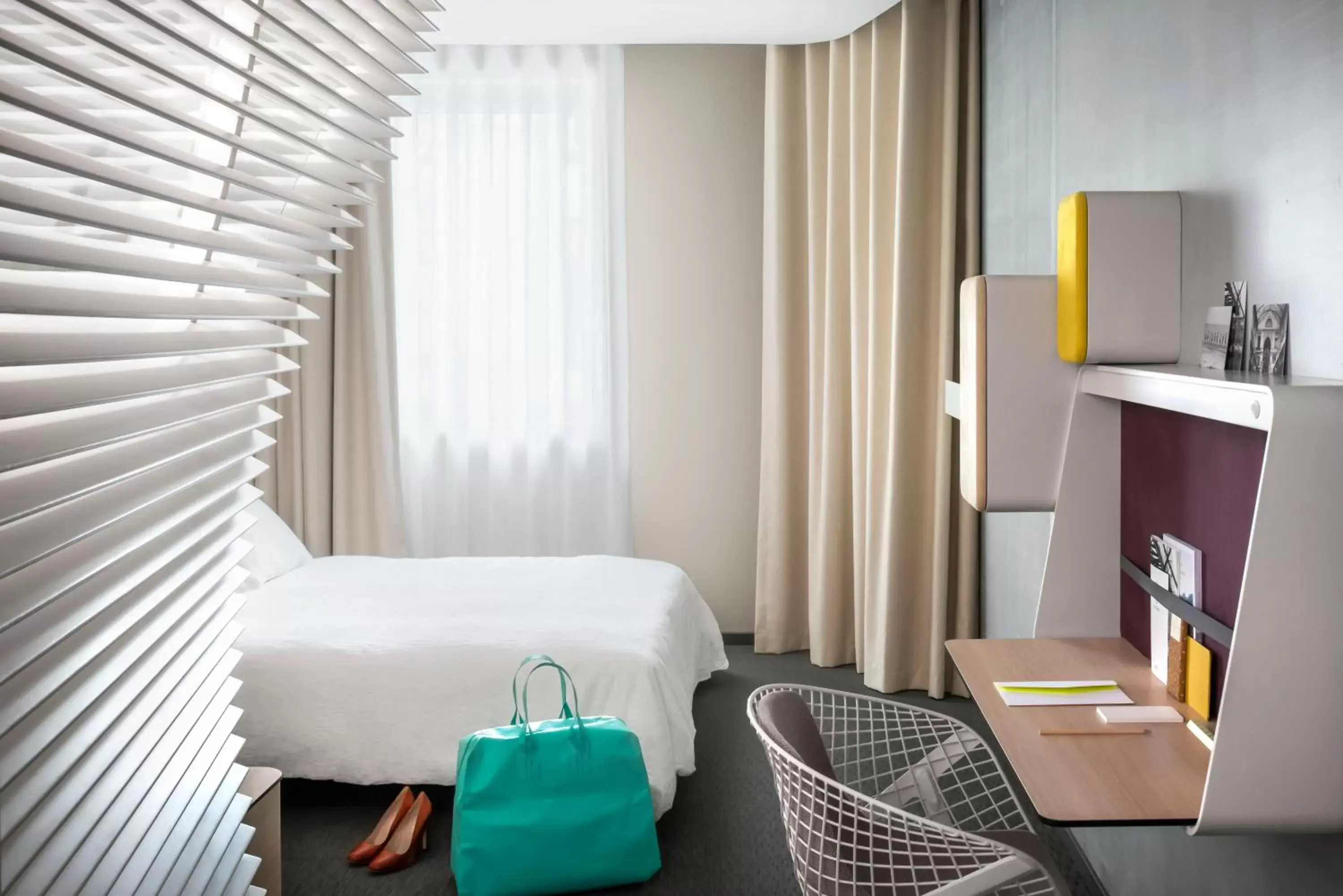 Bedroom, TV/Entertainment Center in Okko Hotels Lyon Pont Lafayette
