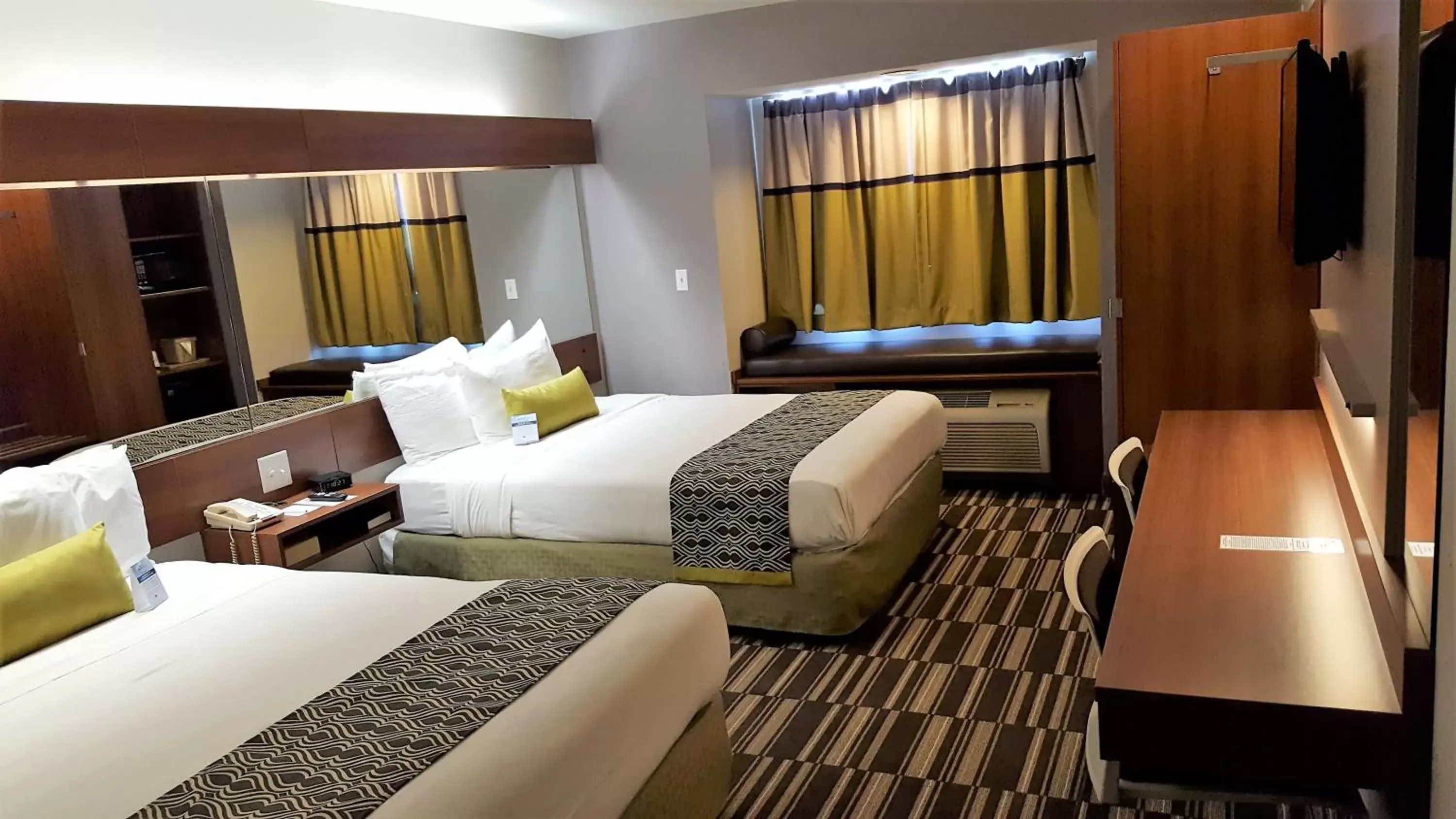 Bed in Microtel Inn & Suites by Wyndham Bellevue