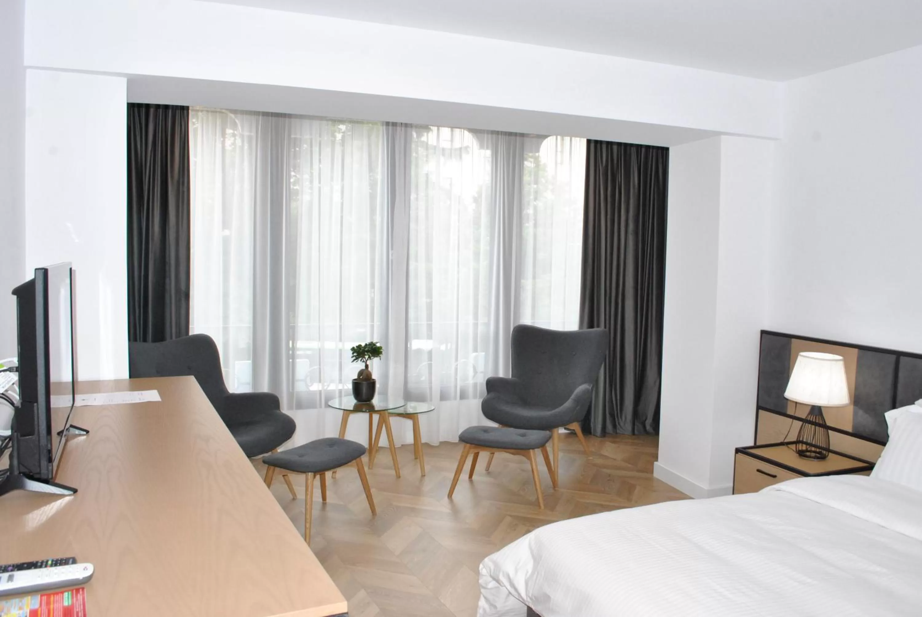 Seating area, Bed in Prime Hotel