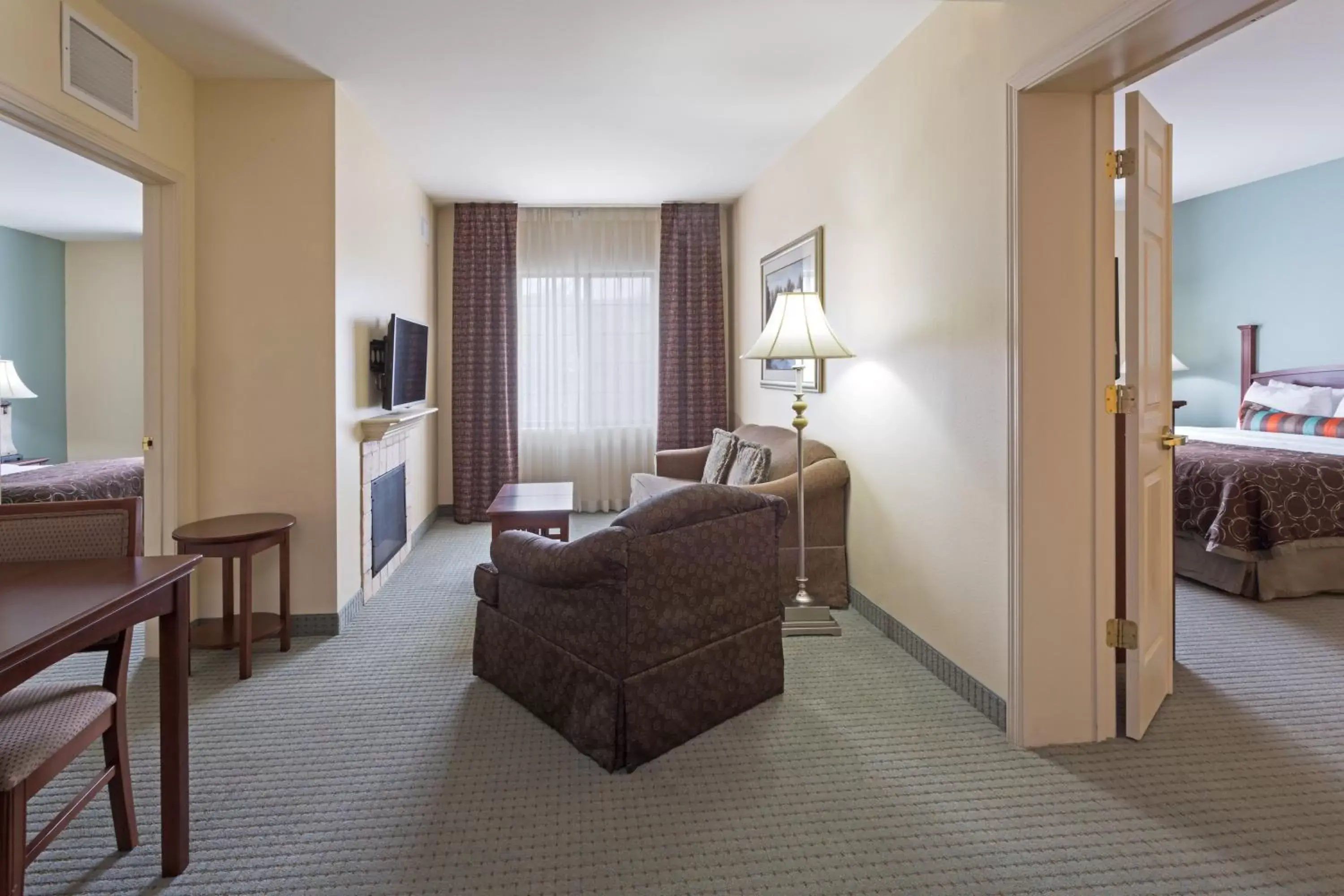 Photo of the whole room, Seating Area in Staybridge Suites Tallahassee I-10 East, an IHG Hotel