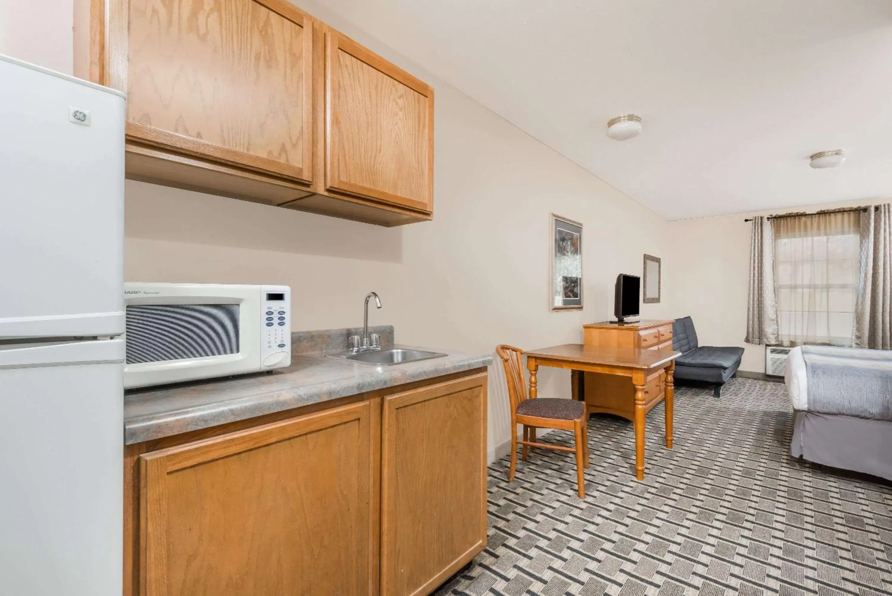 Photo of the whole room, Kitchen/Kitchenette in Days Inn & Suites by Wyndham Sellersburg