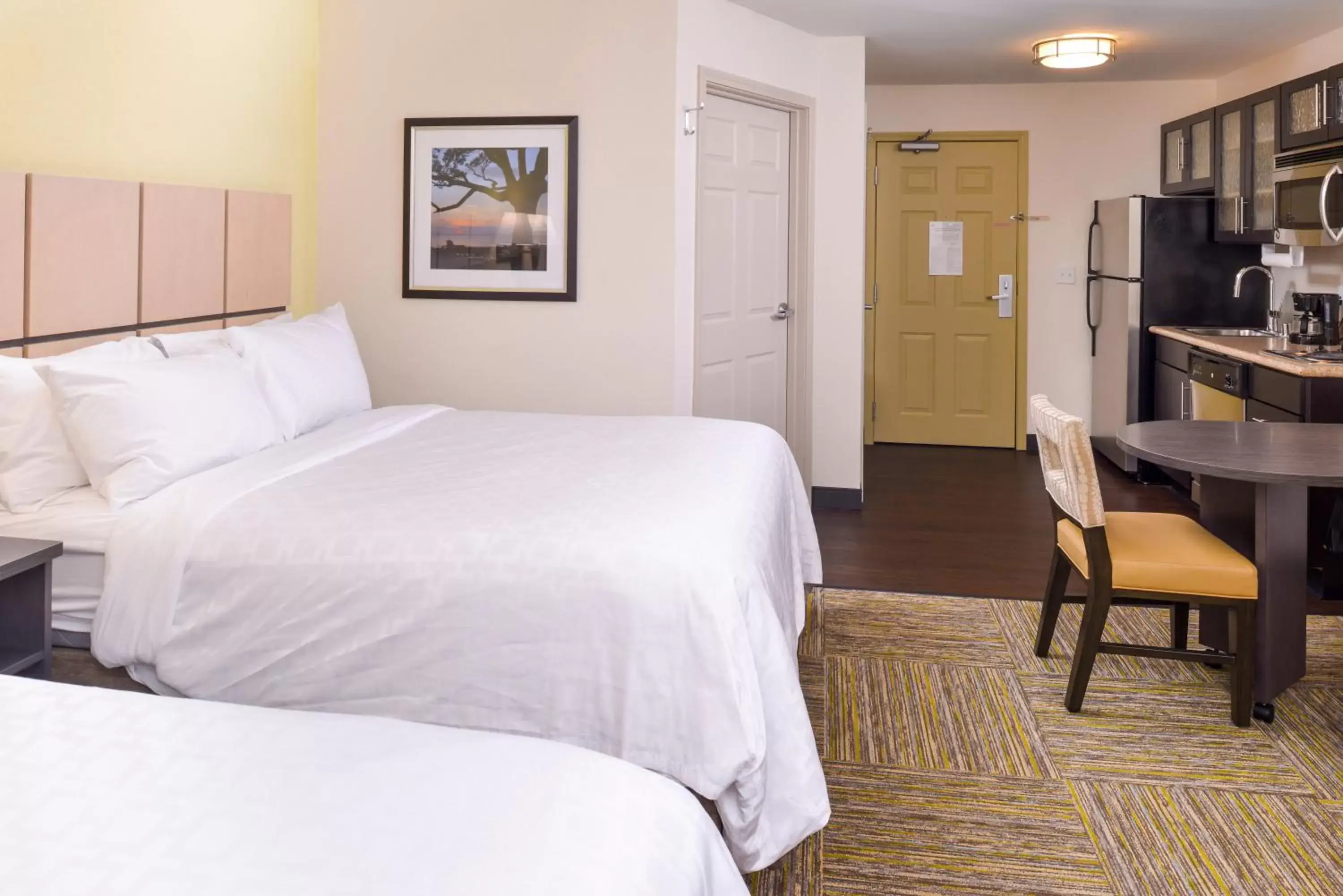 Bed in Candlewood Suites - Plano North, an IHG Hotel