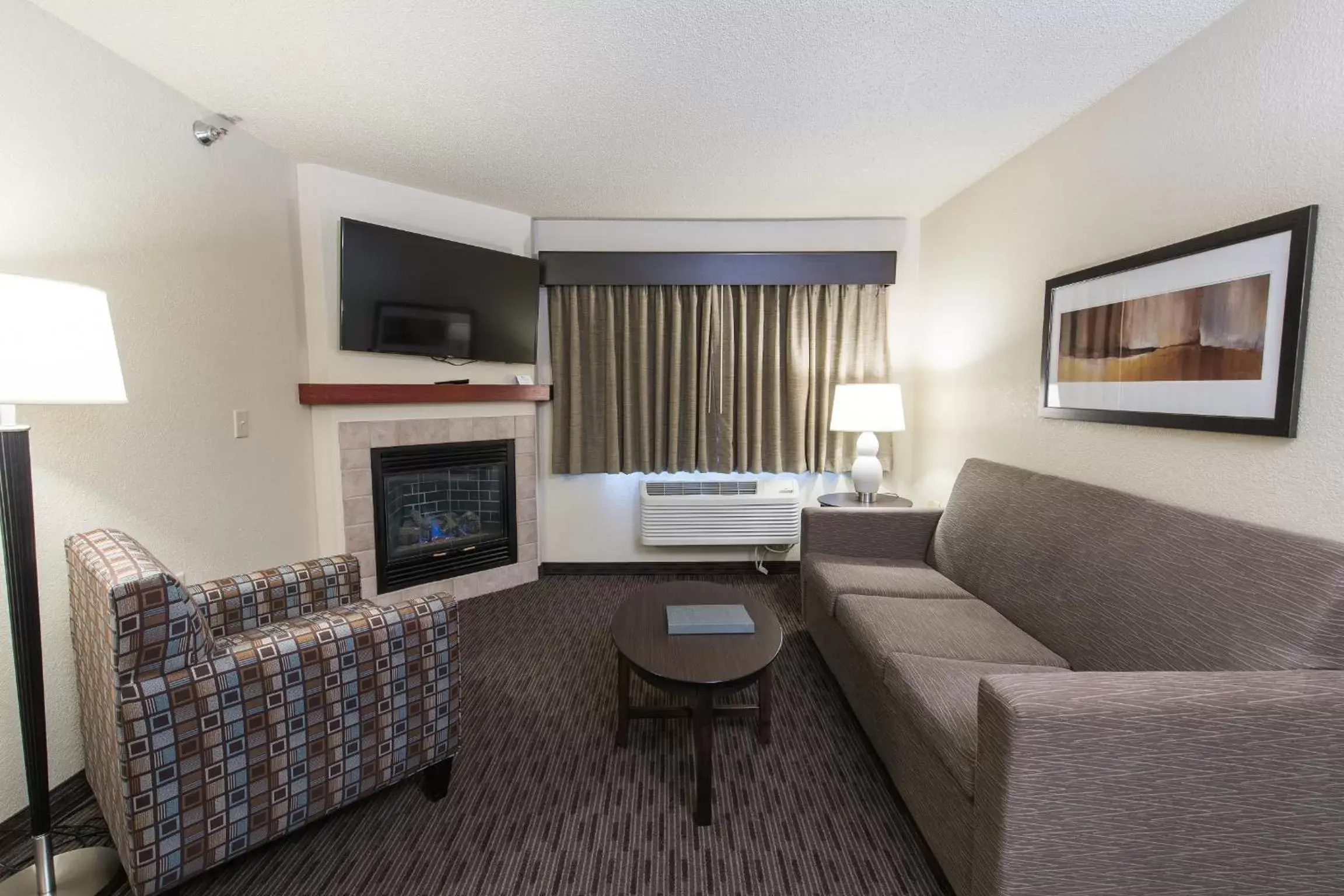 Living room, Seating Area in AmericInn by Wyndham Mounds View Minneapolis