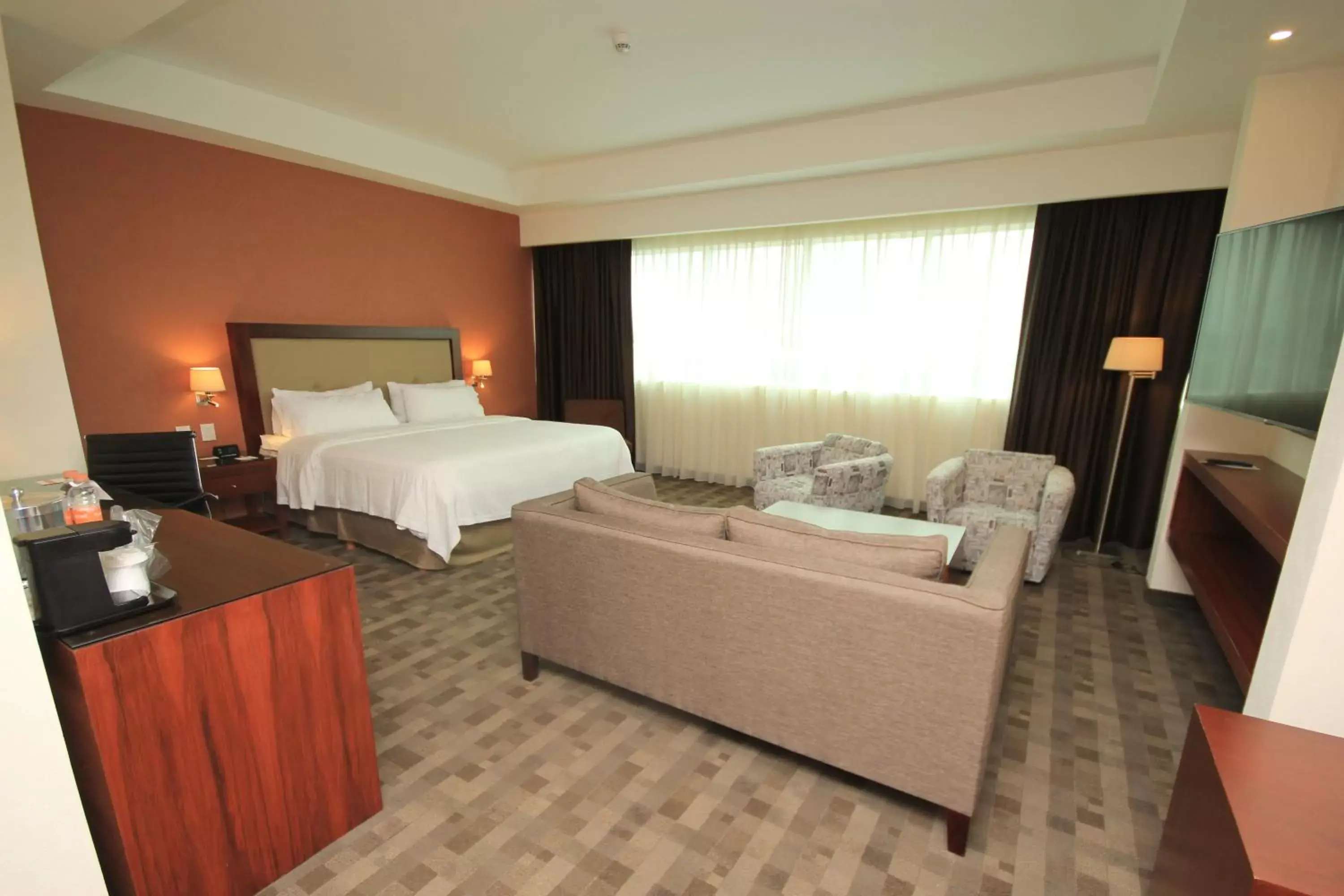 Photo of the whole room, Bed in Holiday Inn & Suites Plaza Mayor, an IHG Hotel