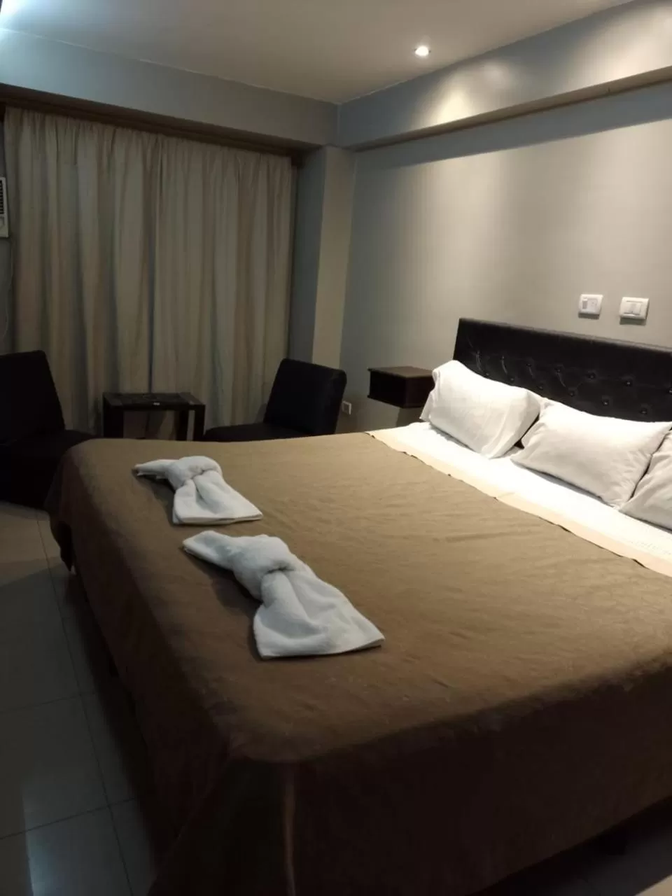 Bed in Lorenzo Suites Hotel