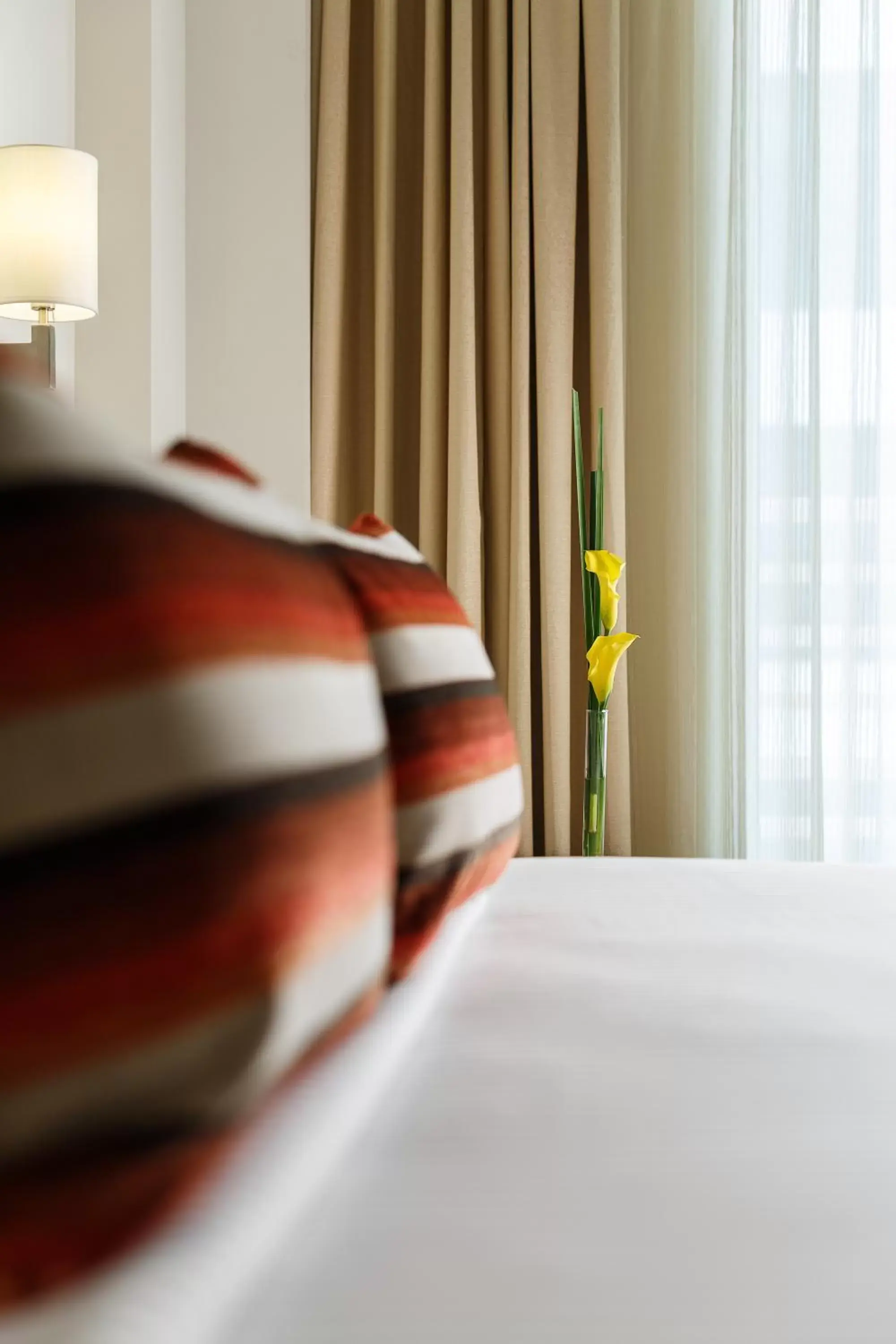 Bed in Sandal Suites by Lemon Tree Hotels Bed in Sandal Suites by Lemon Tree Hotels