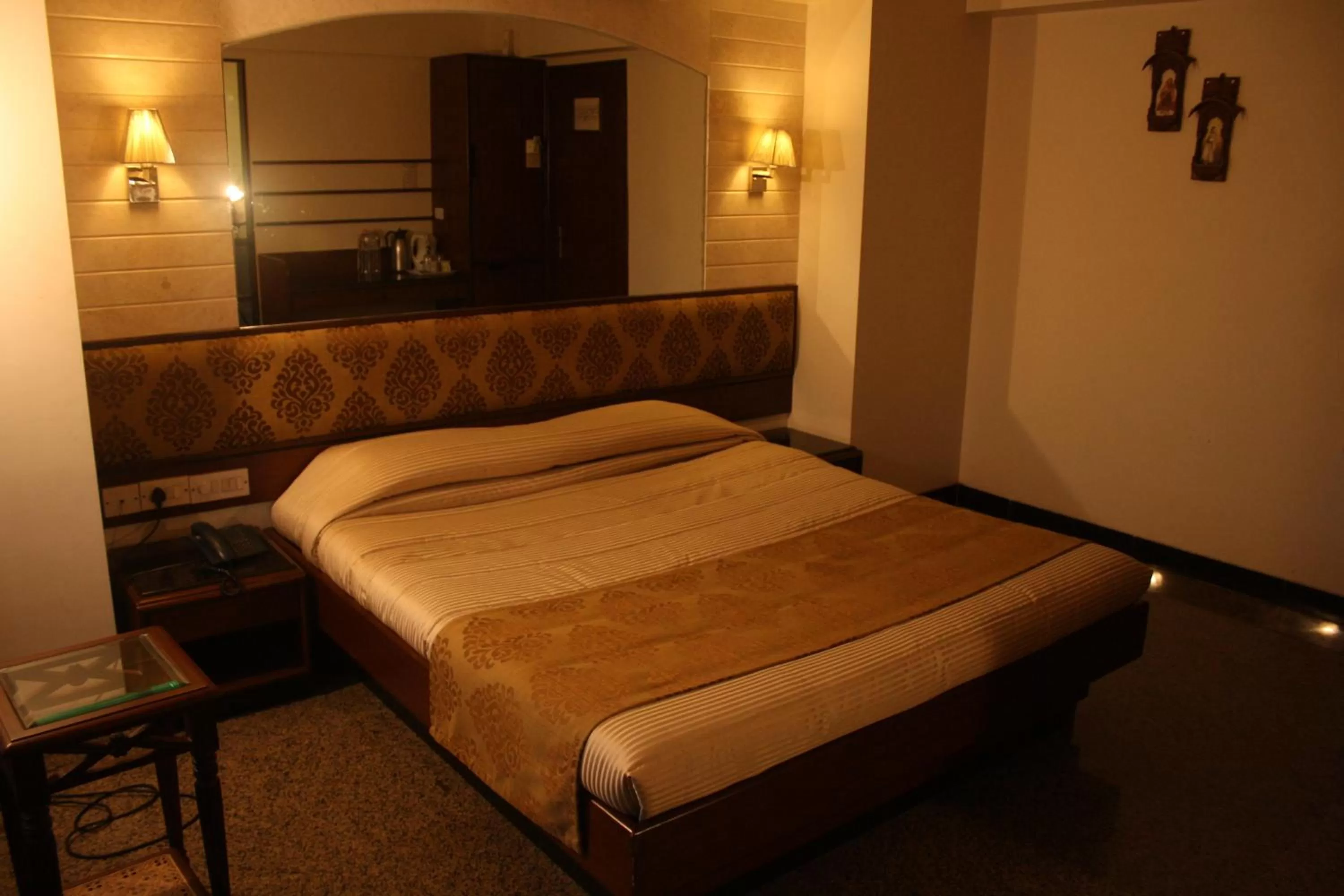 Bed in Hotel Karl Residency