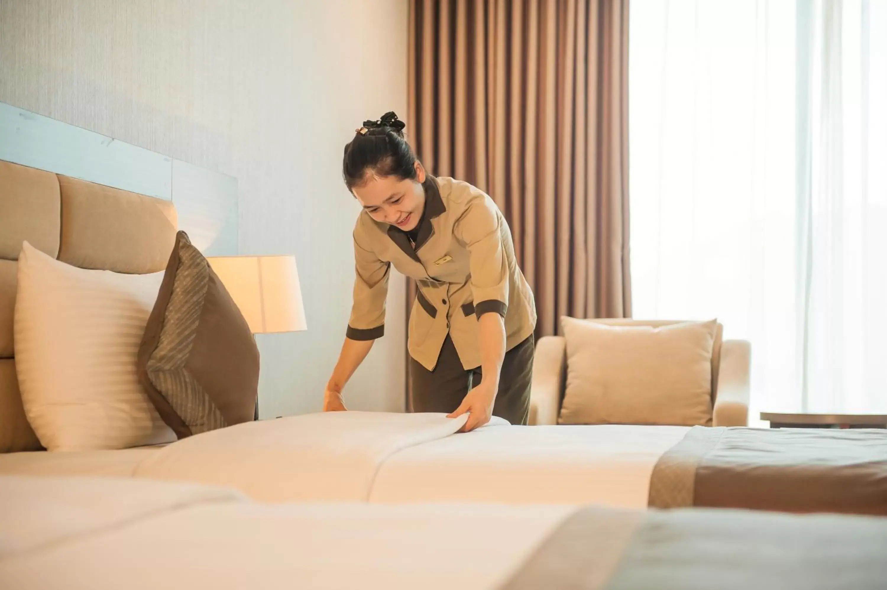 Staff, Bed in Muong Thanh Grand Tuyen Quang Hotel Staff, Bed in Muong Thanh Grand Tuyen Quang Hotel