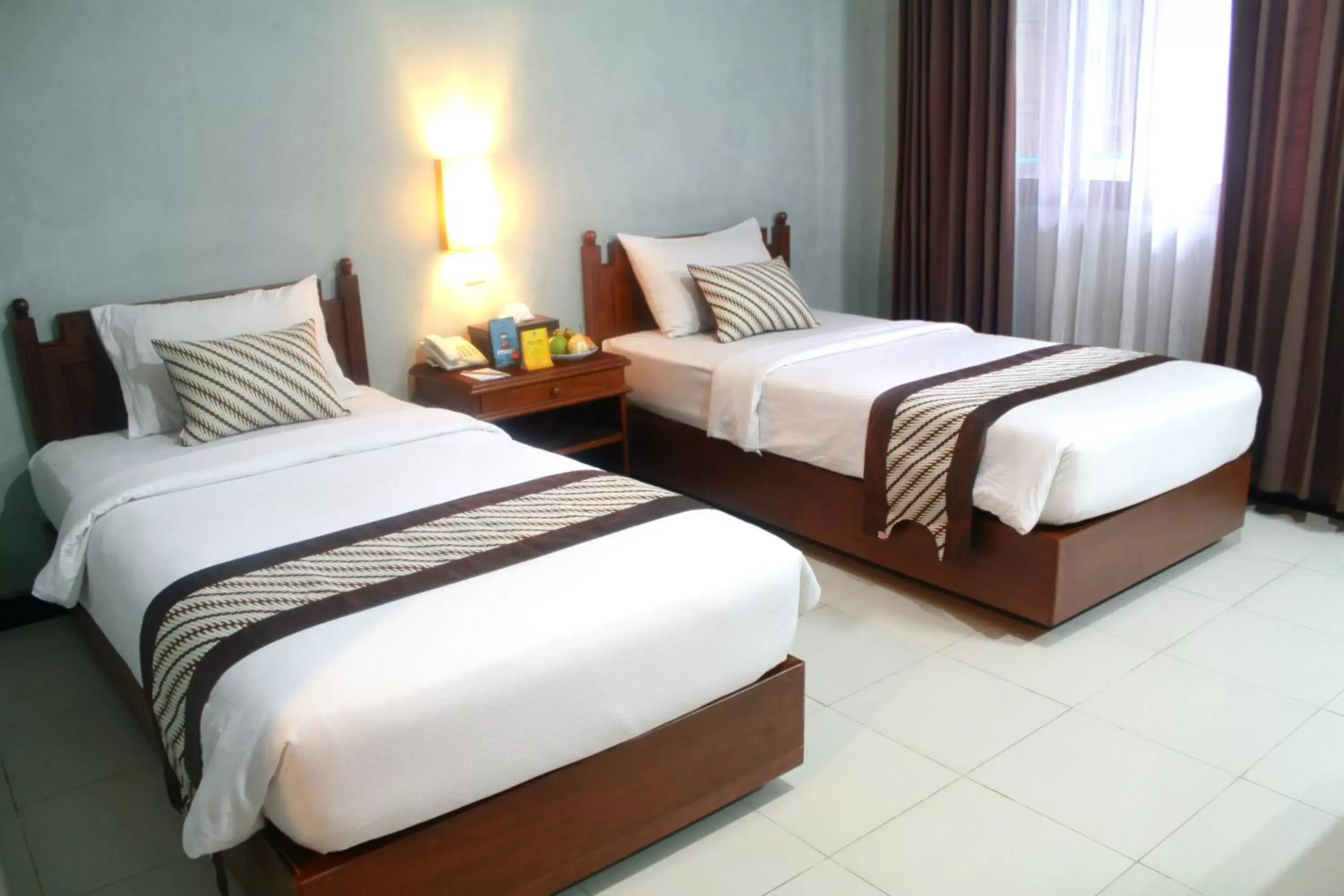 Bed in Cakra Kusuma Hotel