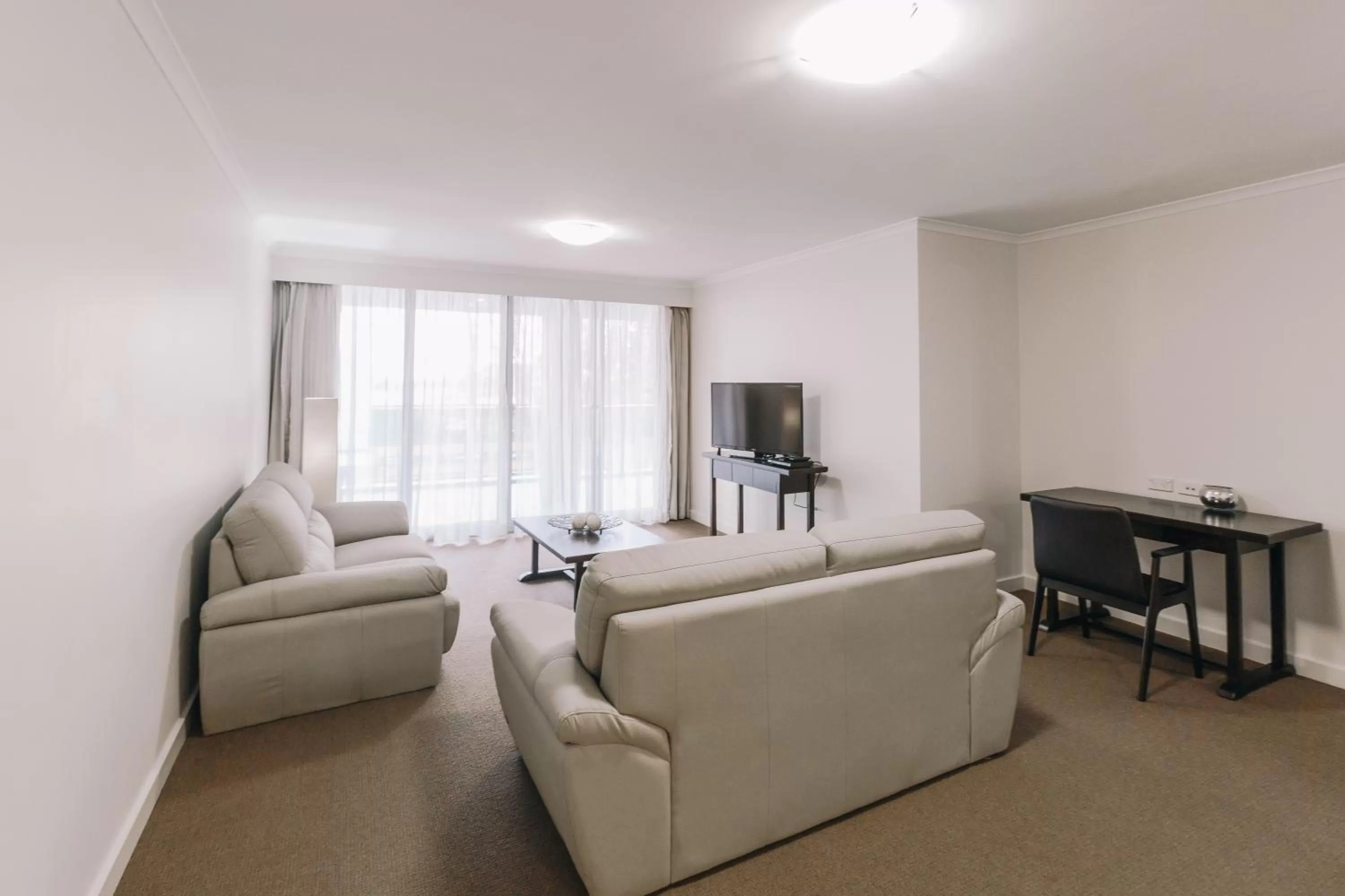 Living room in Newcastle Central Plaza Apartment Hotel Official