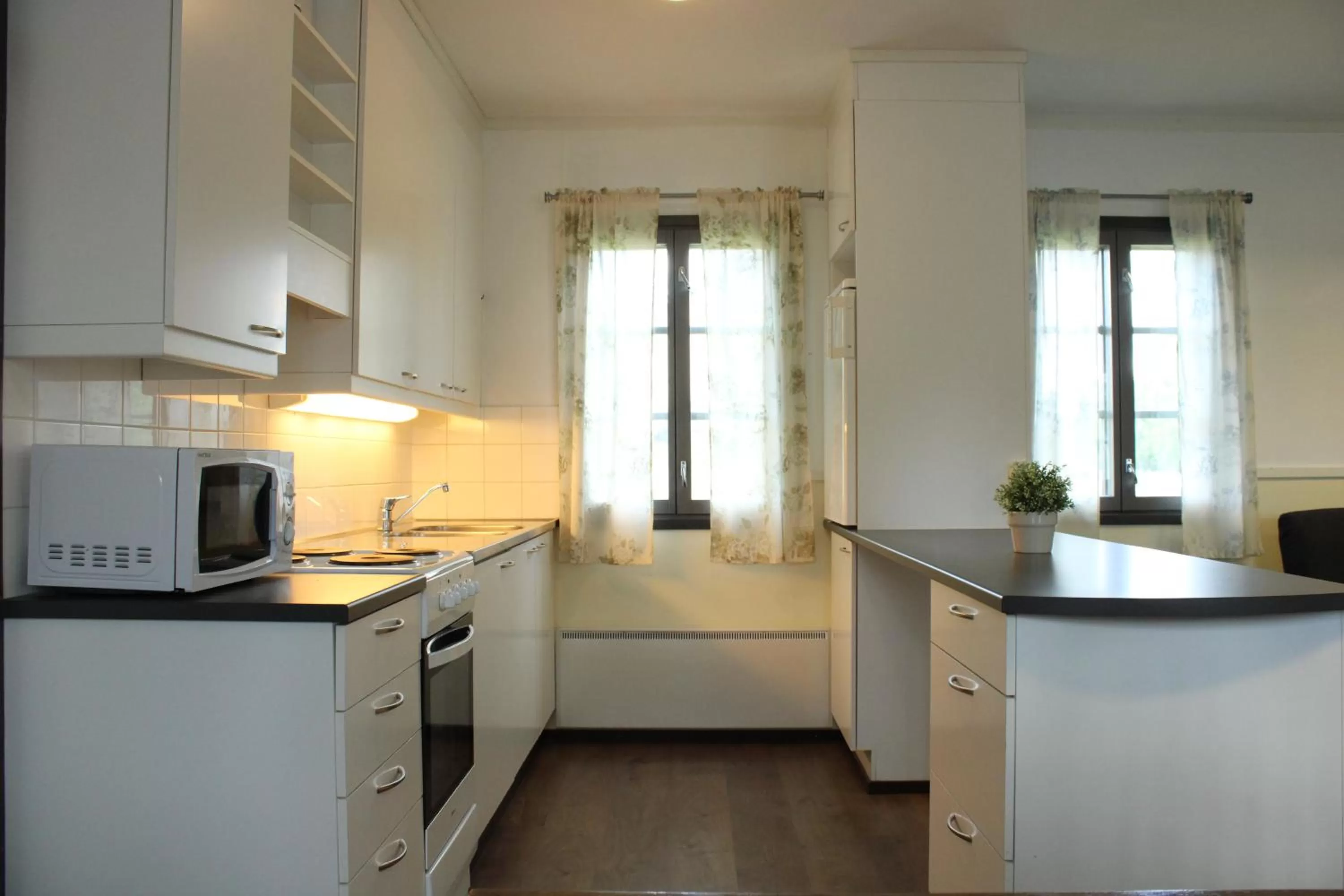 Kitchen or kitchenette in Visulahti Cottages