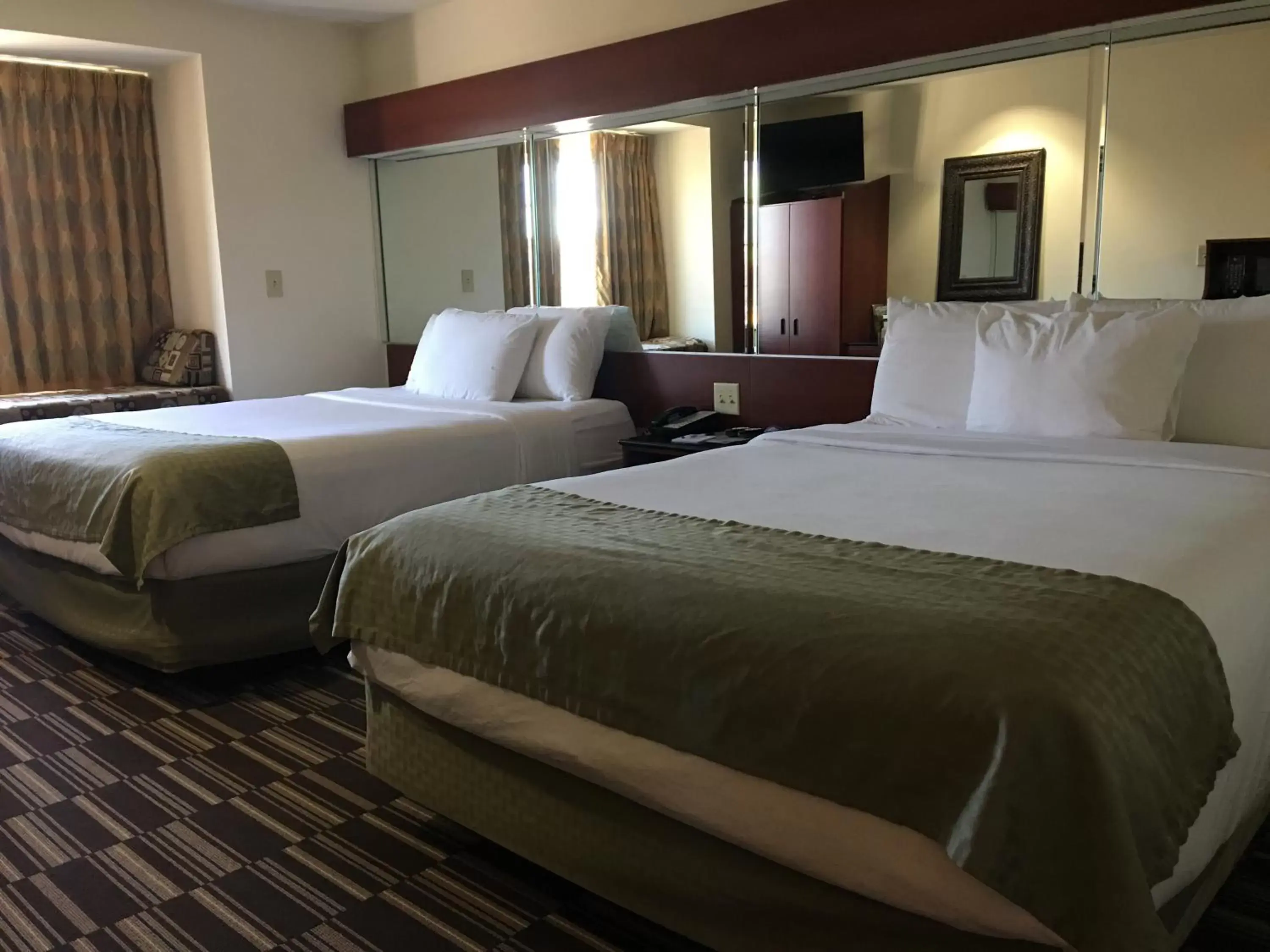 Bed in Microtel Inn & Suites by Wyndham Indianapolis Airport