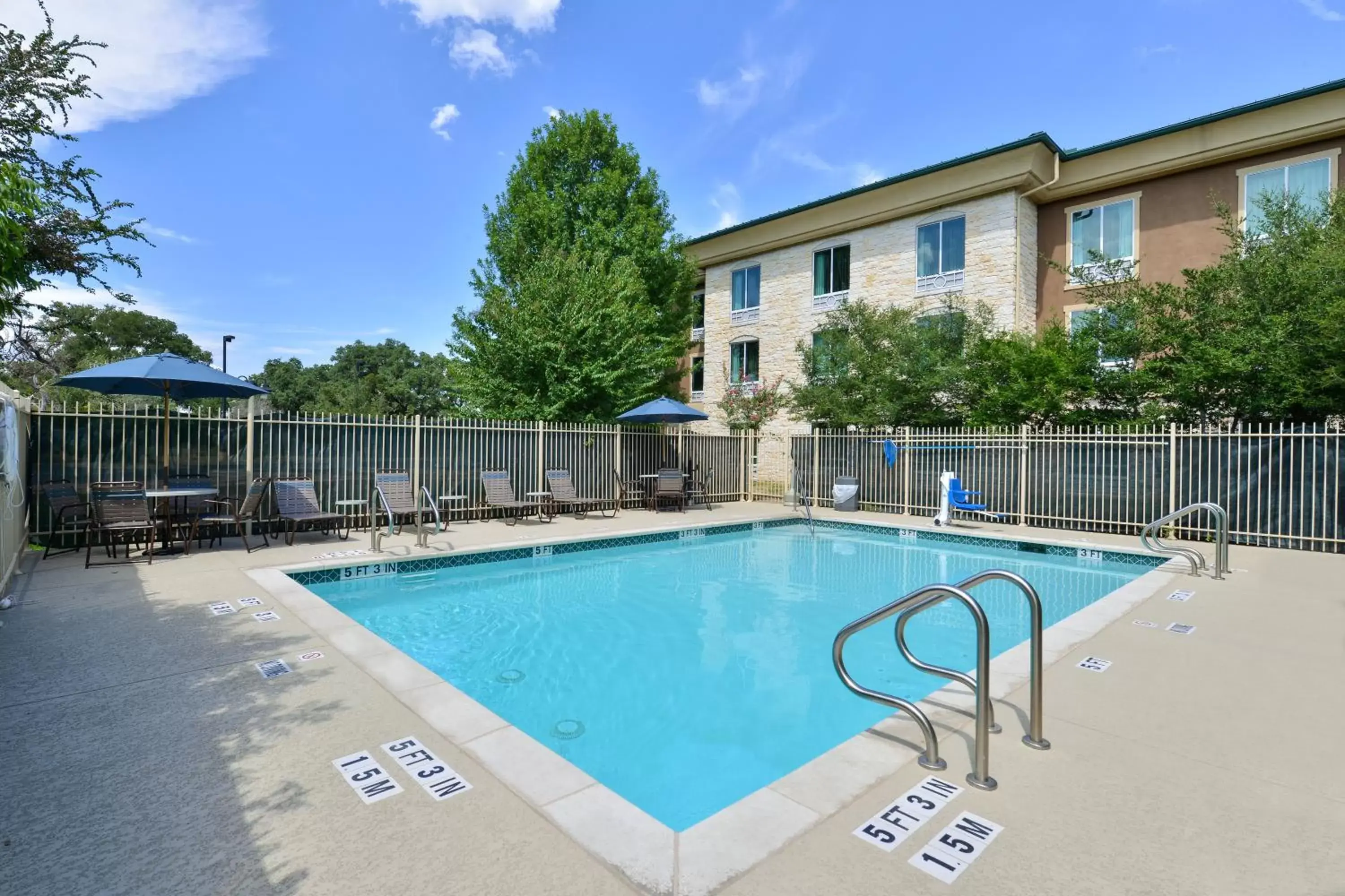 Swimming pool, Property Building in Holiday Inn Express Hotel & Suites Austin SW - Sunset Valley, an IHG Hotel