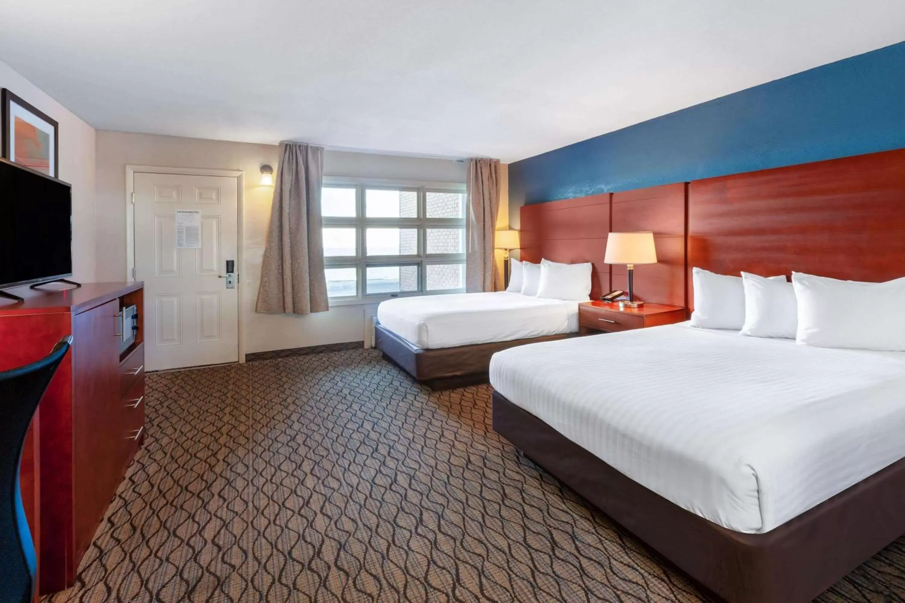 Photo of the whole room, Bed in Baymont by Wyndham St. Ignace Lakefront