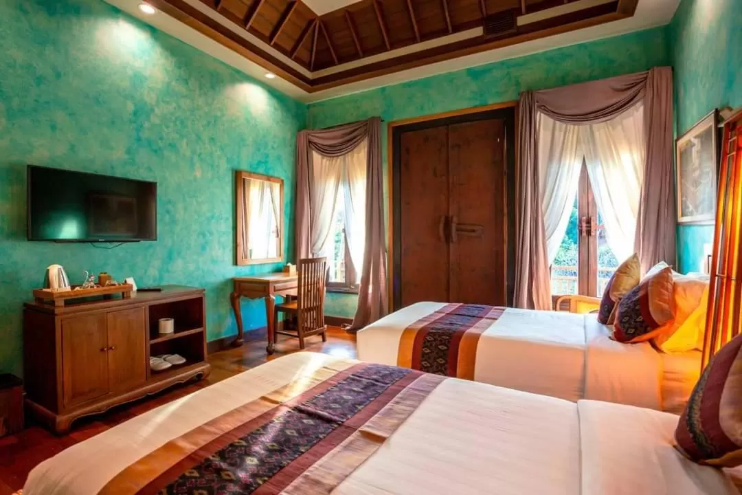 Communal lounge/ TV room, Bed in Amata Lanna Village อมตะล้านนาวิลเลจ