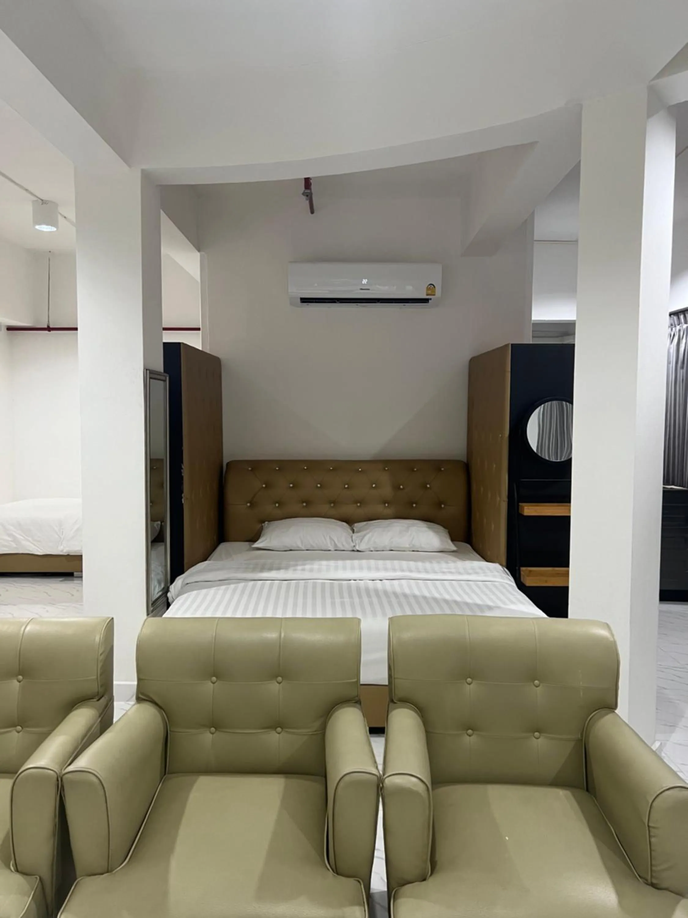 Bed in Mall Suites Hotel