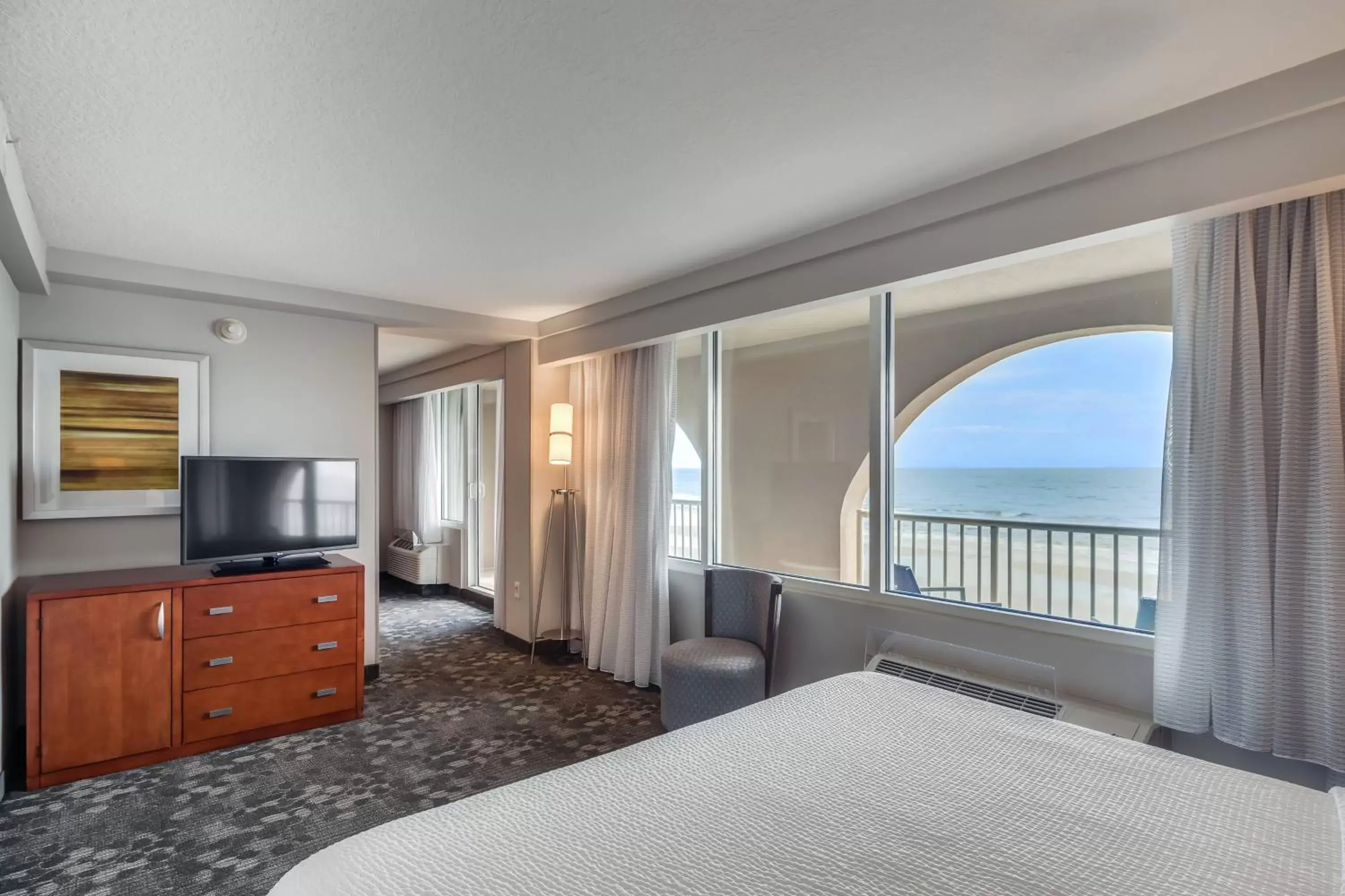 Photo of the whole room, Bed in Courtyard by Marriott Jacksonville Beach Oceanfront
