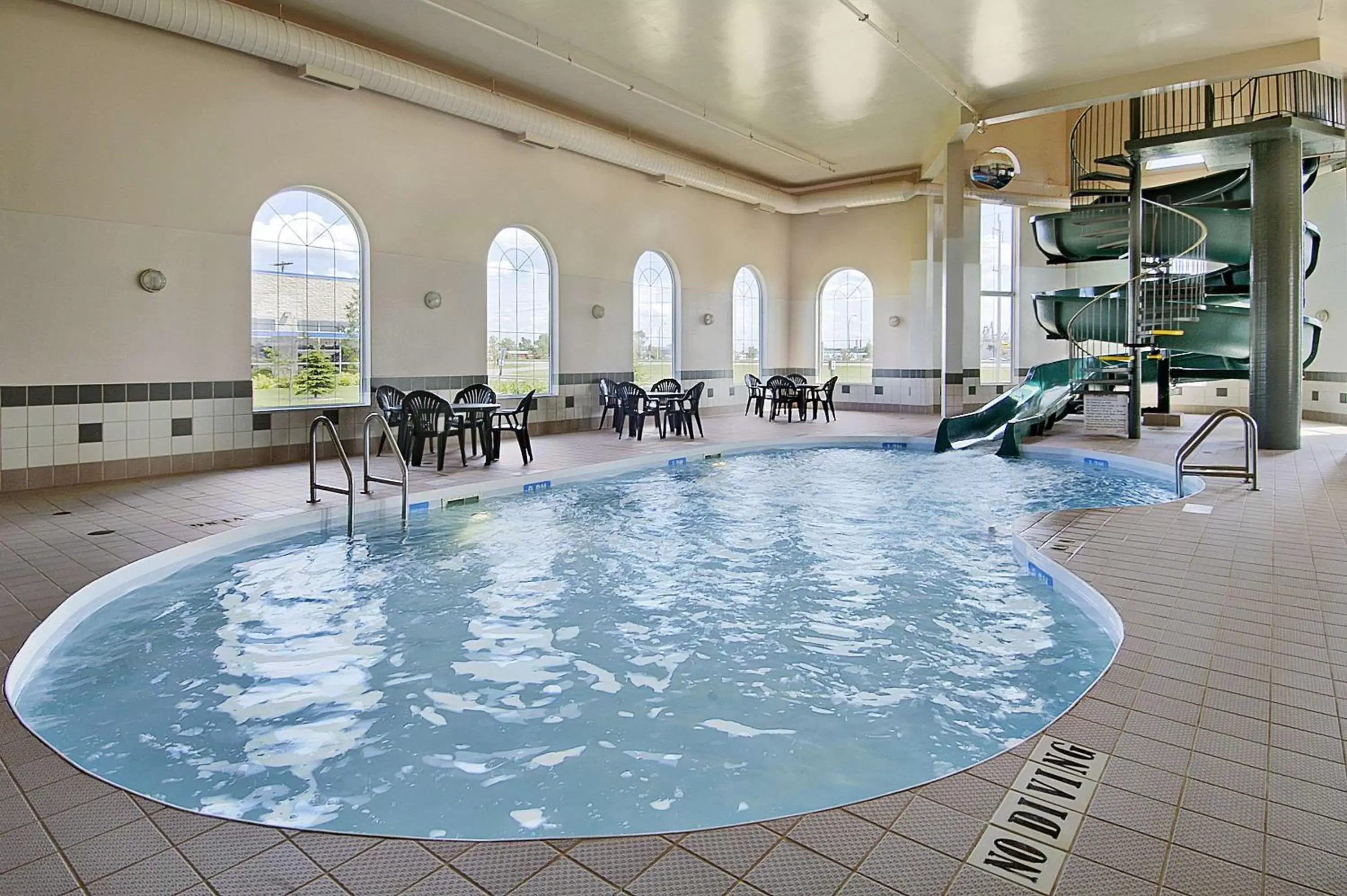 On site, Swimming Pool in Days Inn & Suites by Wyndham Winkler