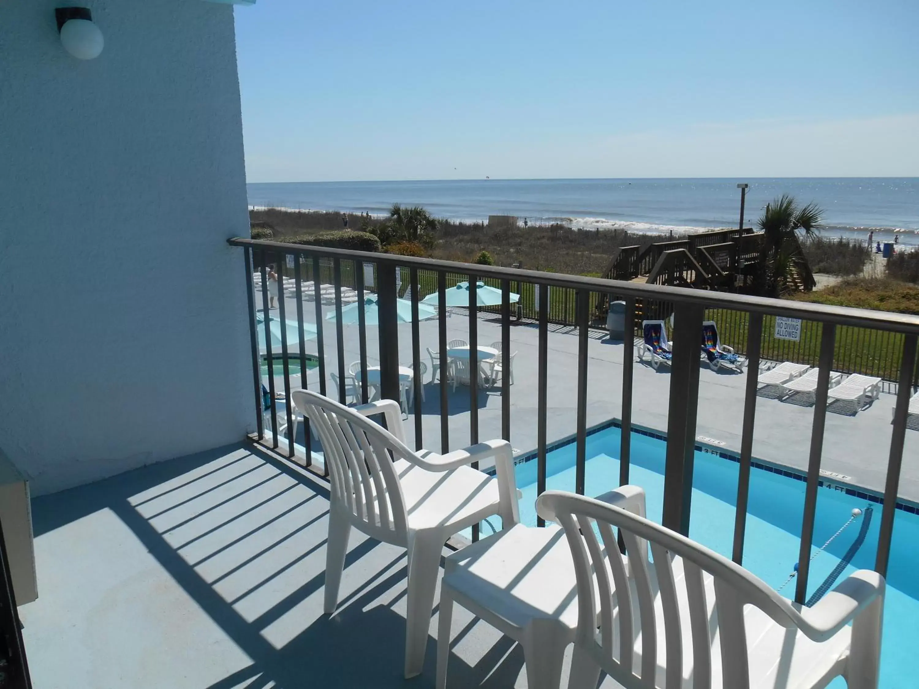 Balcony/Terrace, Pool View in Tropical Seas Hotel