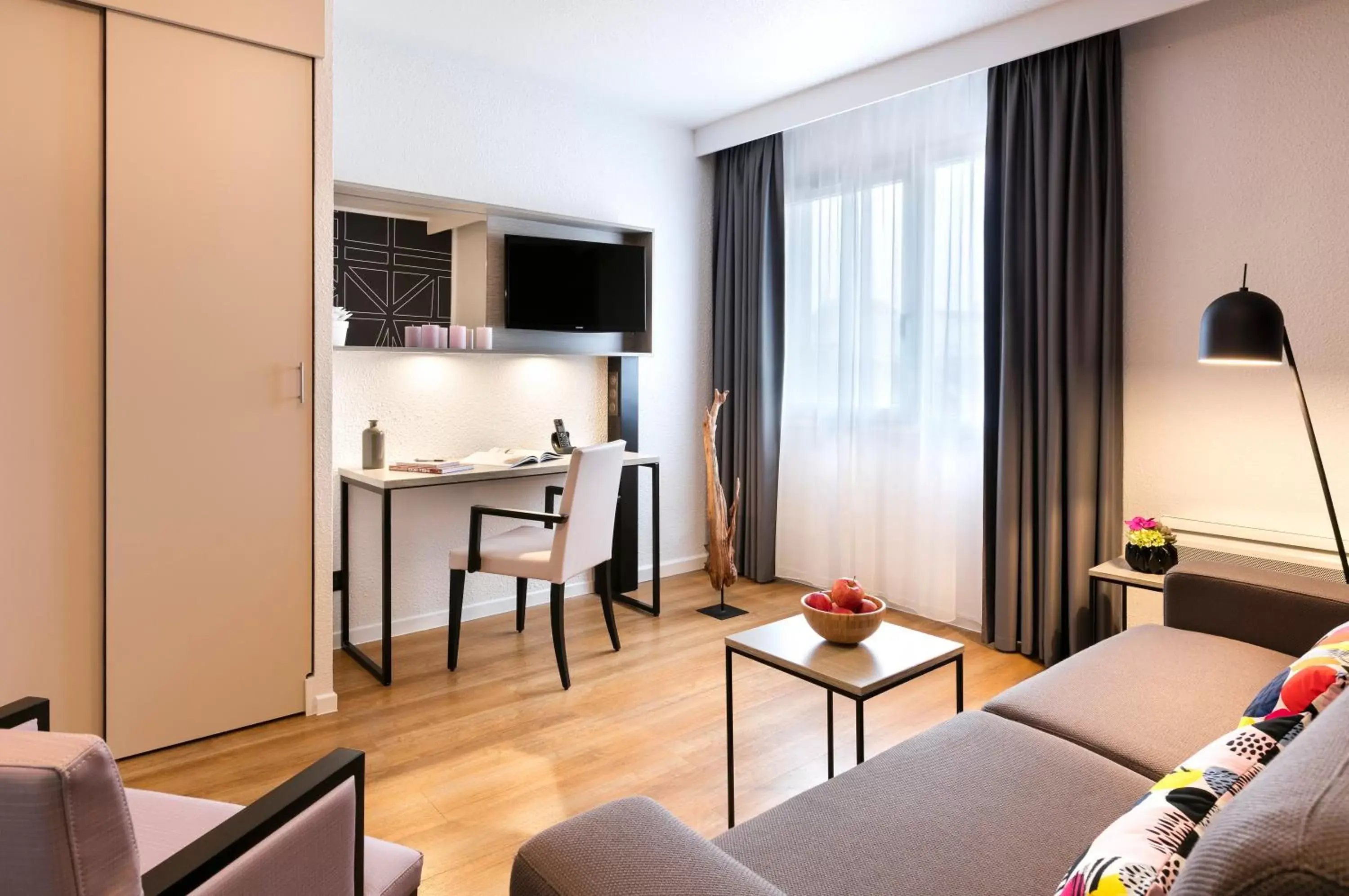 Living room, TV/Entertainment Center in Citadines Kléber Strasbourg