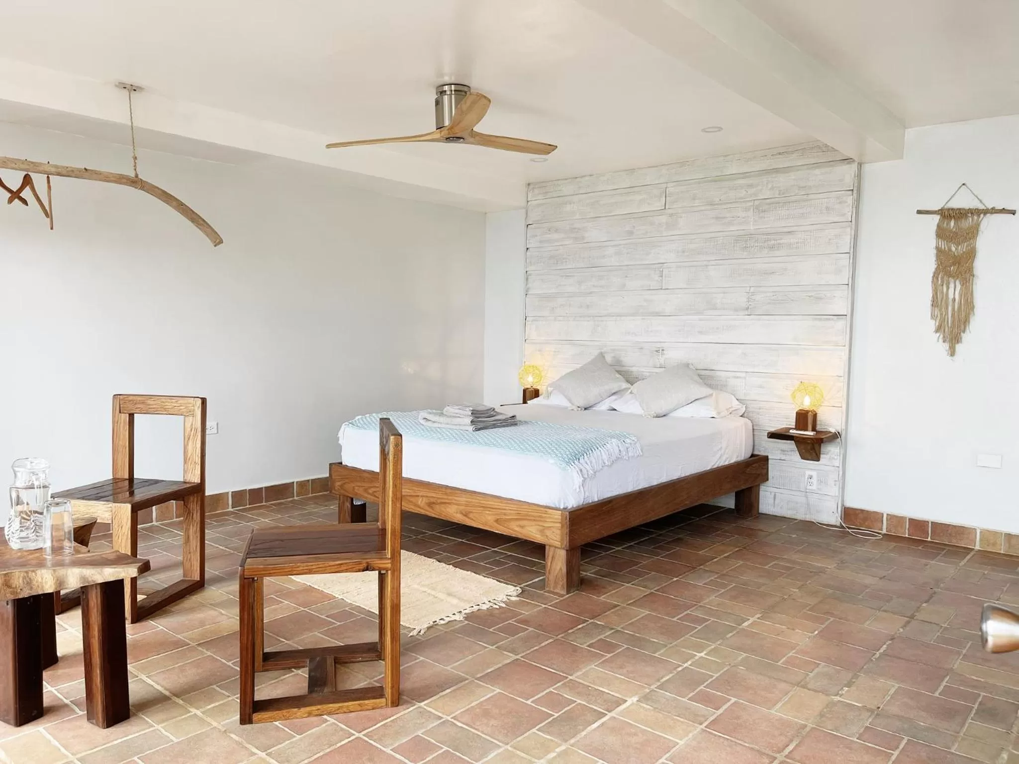Seating area, Bed in Bird Island Bungalows