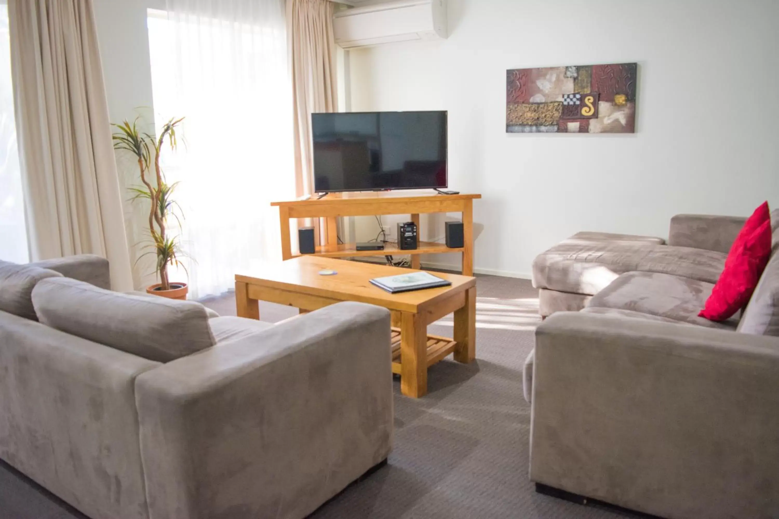 TV and multimedia, Seating Area in Beachside Holiday Apartments