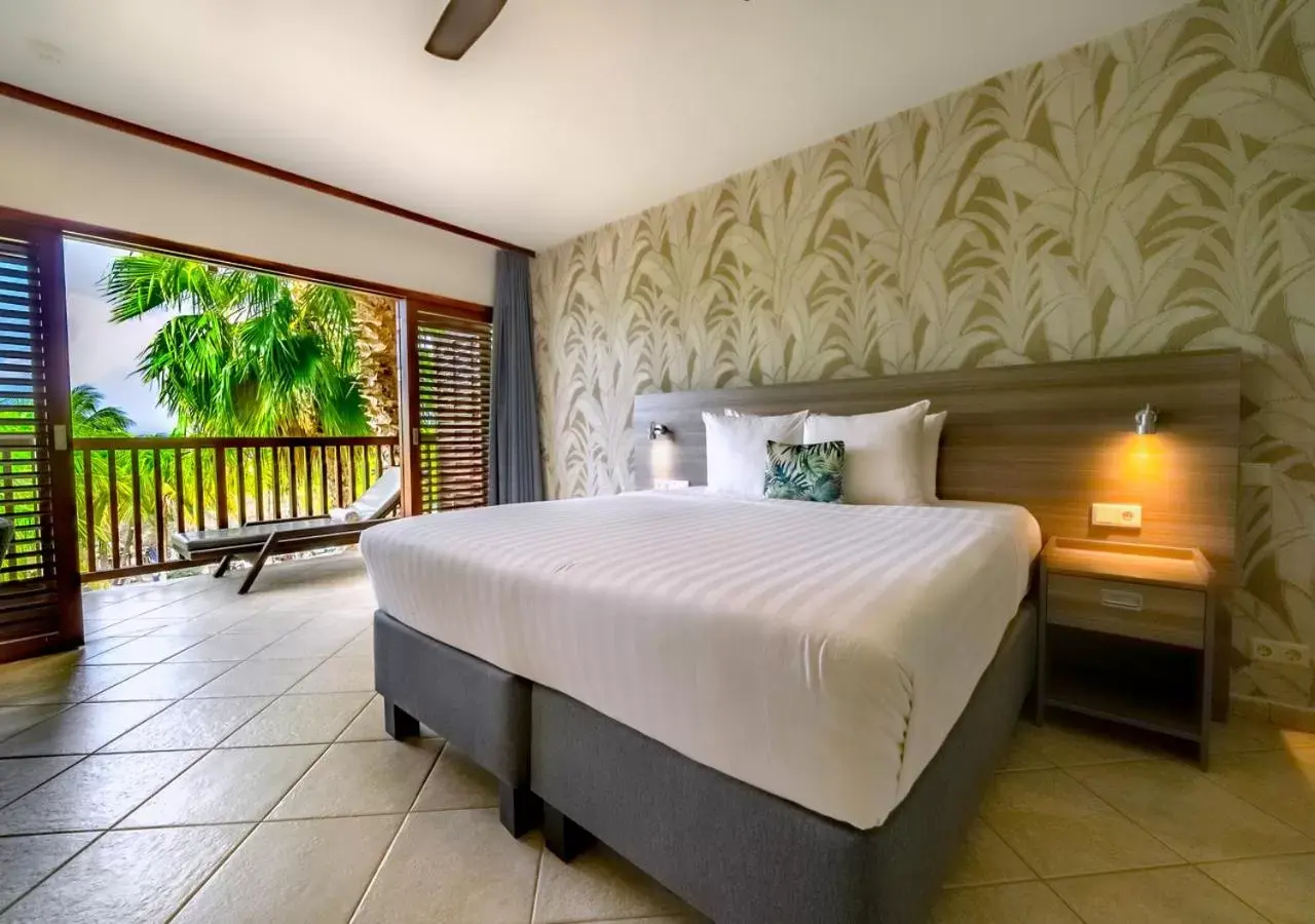 Bed in LionsDive Beach Resort