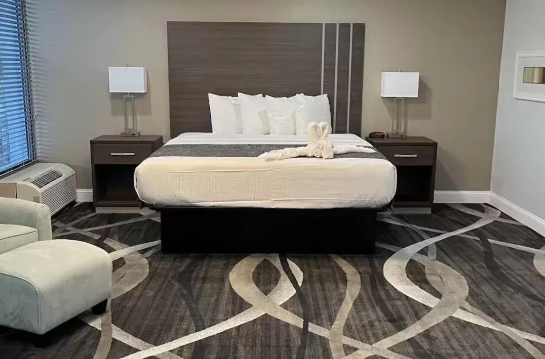 Bed in Opal Hotel & Suites