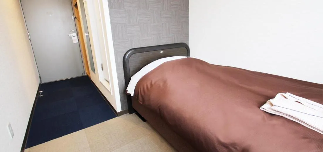 Bed in Takamatsu City Hotel