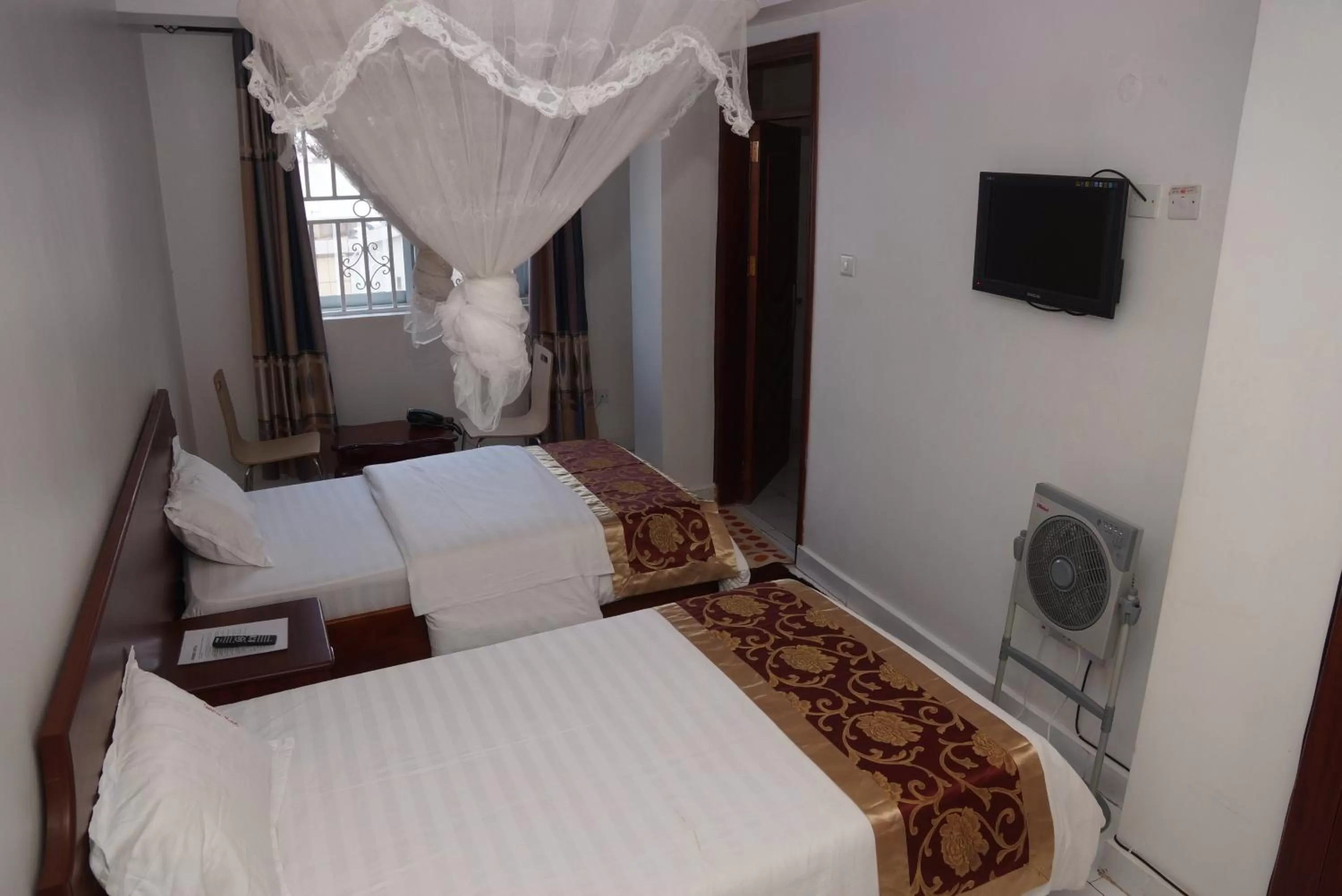 Bed in Sunrise Hotel Kampala