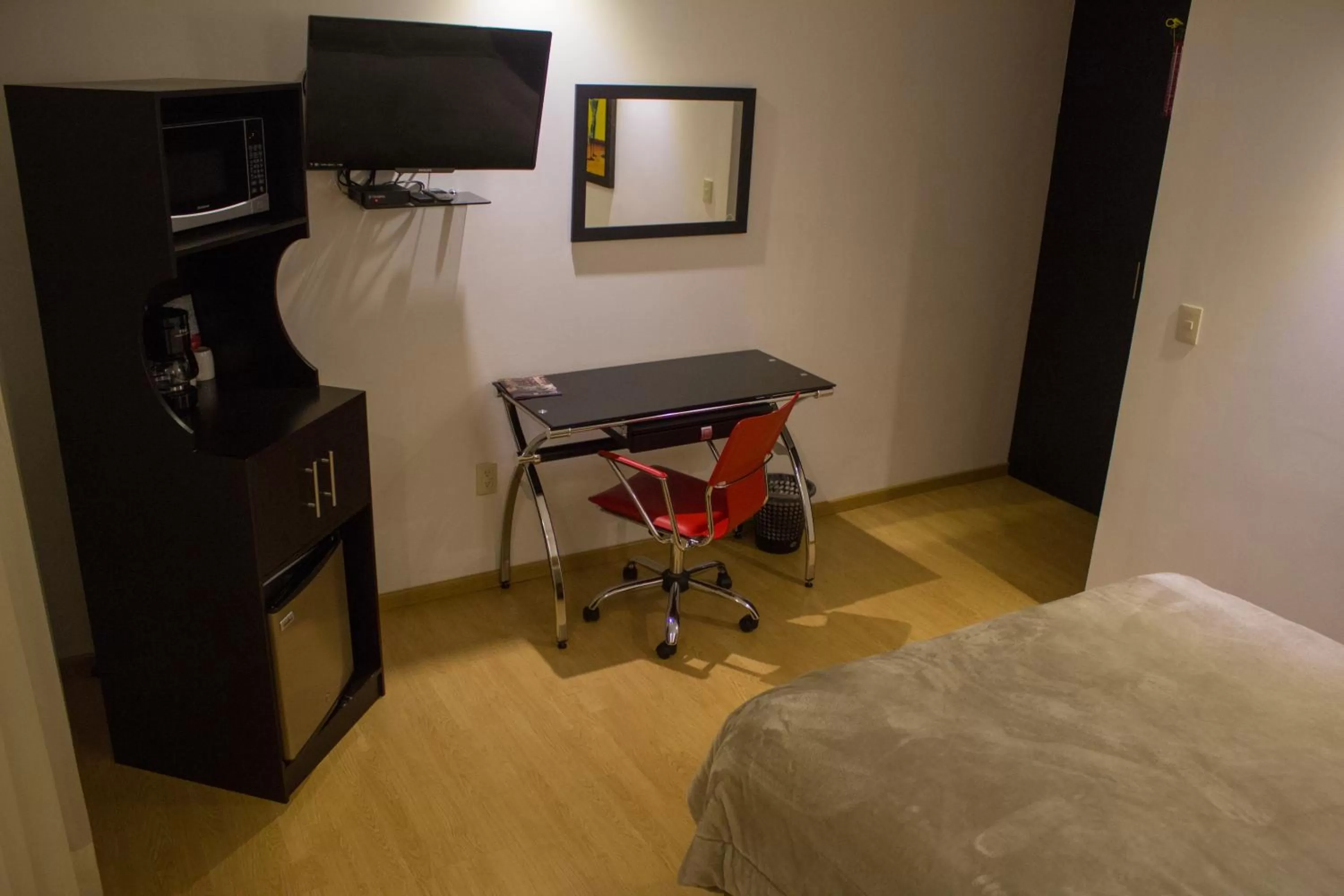 Photo of the whole room, Bed in My Home Suites