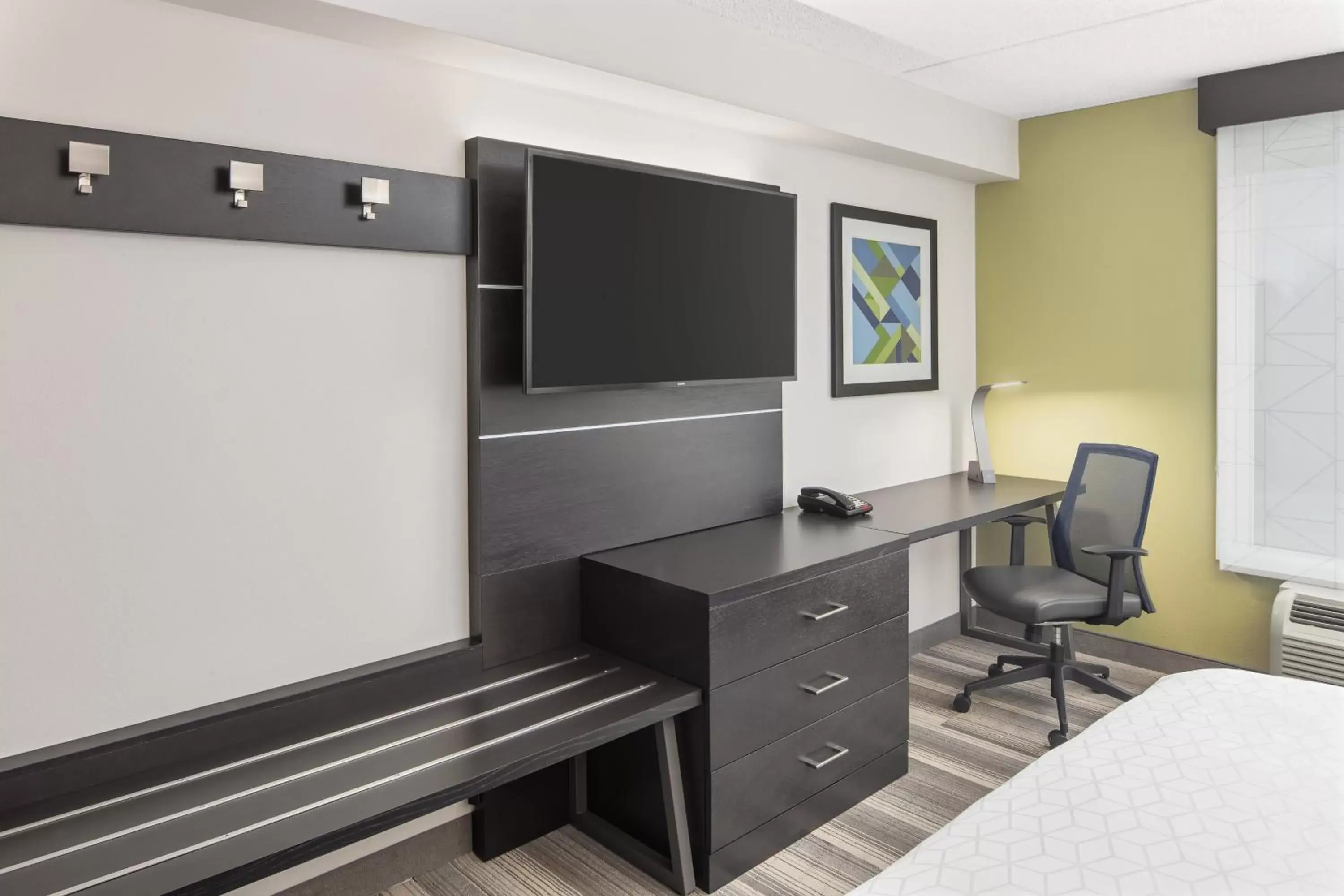 Bedroom, TV/Entertainment Center in Holiday Inn Express Hotel & Suites Greenville-I-85 & Woodruff Road, an IHG Hotel