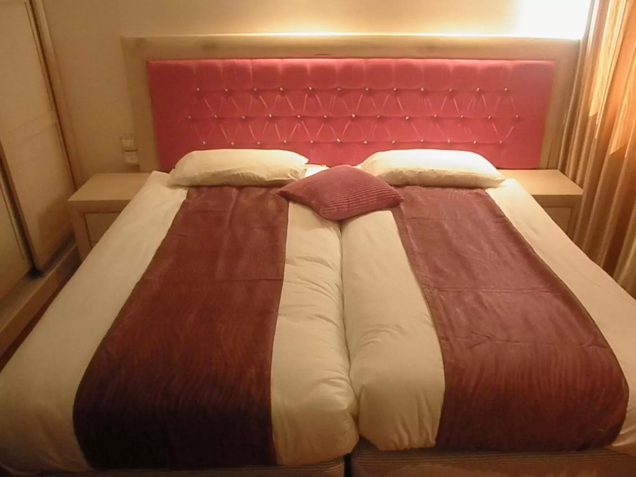 Bed in Commodore Hotel