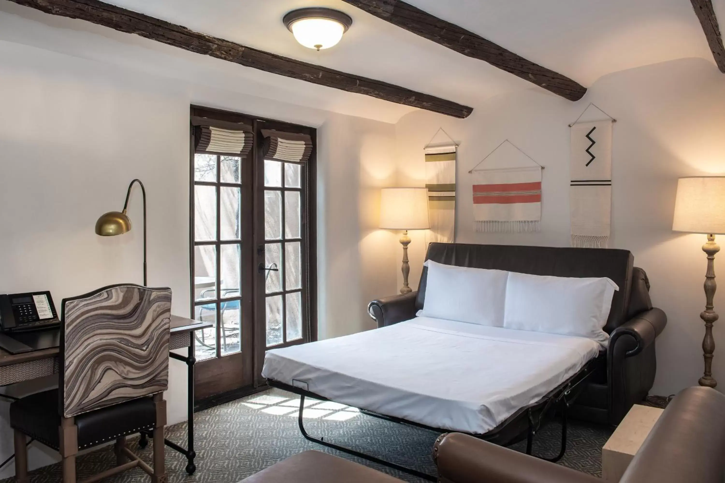Living room, Bed in La Posada De Santa Fe, a Tribute Portfolio Resort & Spa