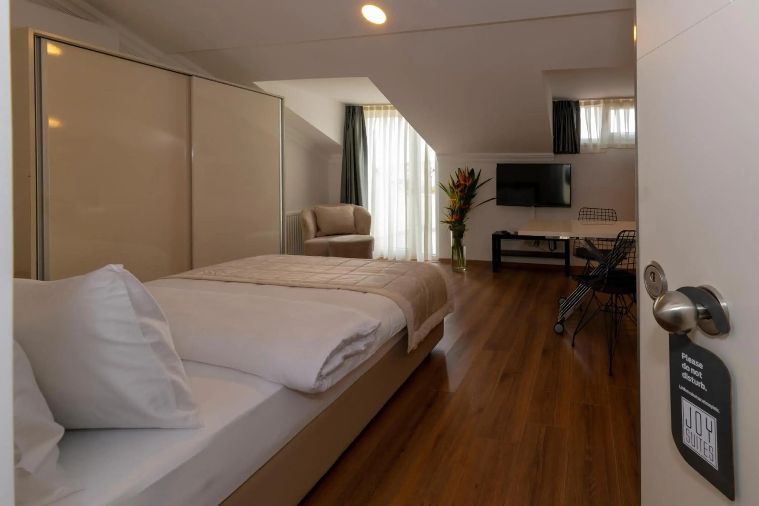 Photo of the whole room, Bed in Joy Suites