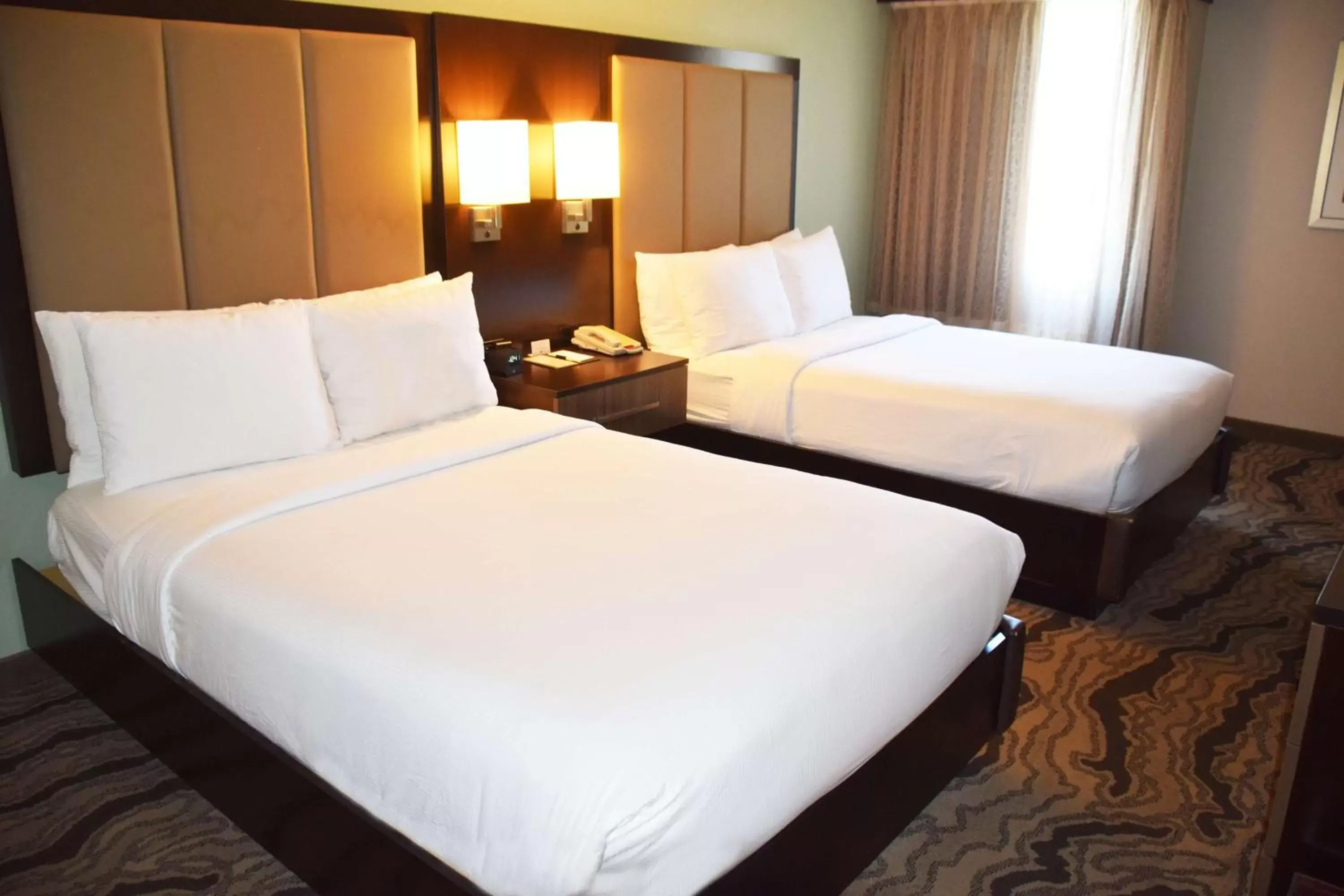 Bed in DoubleTree by Hilton Montgomery Downtown