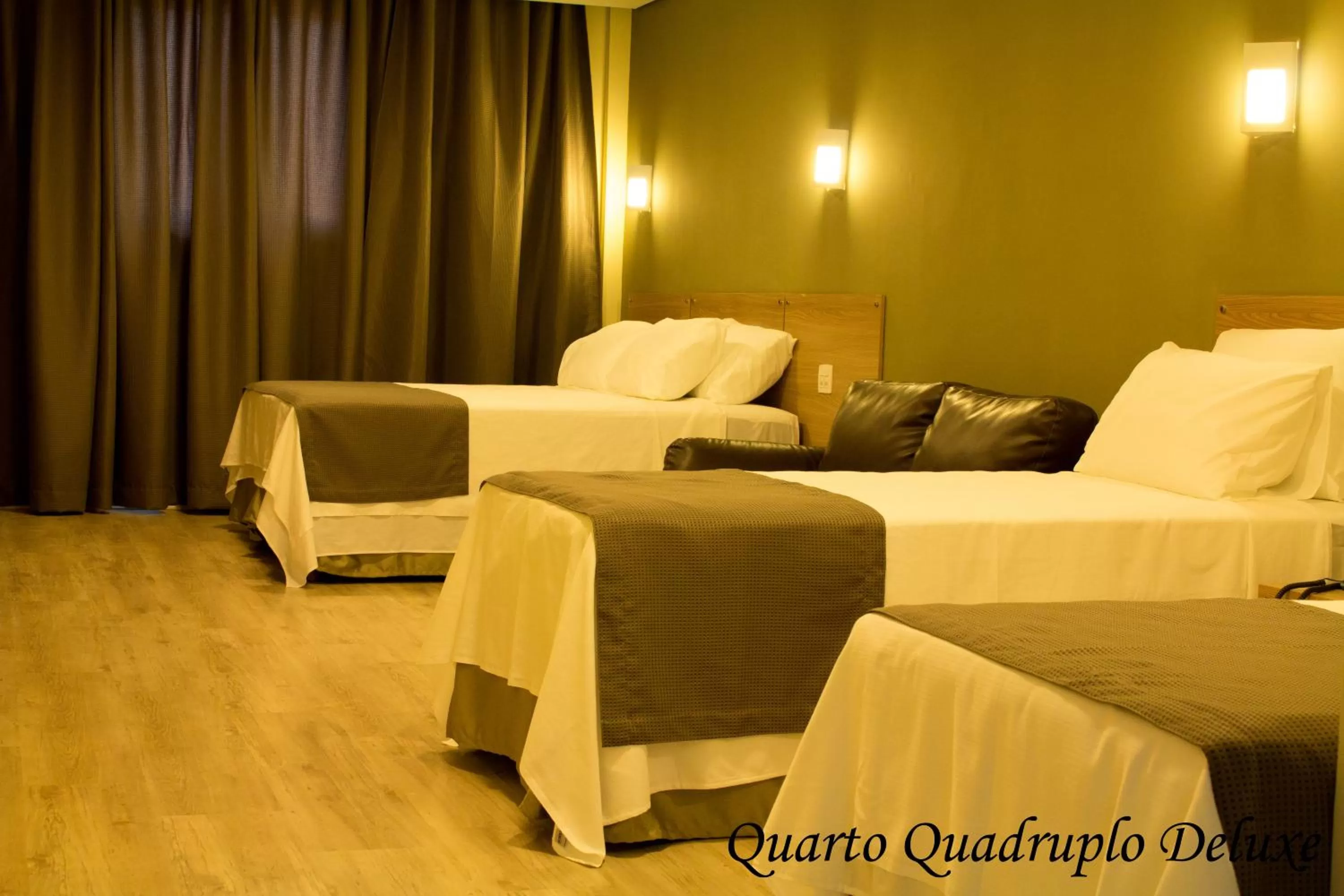 Bed in Minas Platinum Hotel & Convention