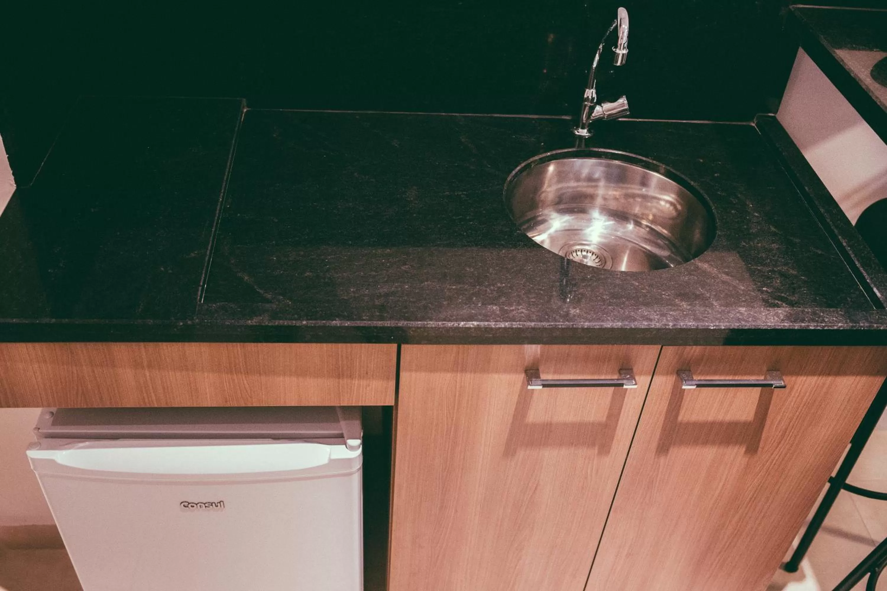 Kitchen or kitchenette in Occitano Apart Hotel