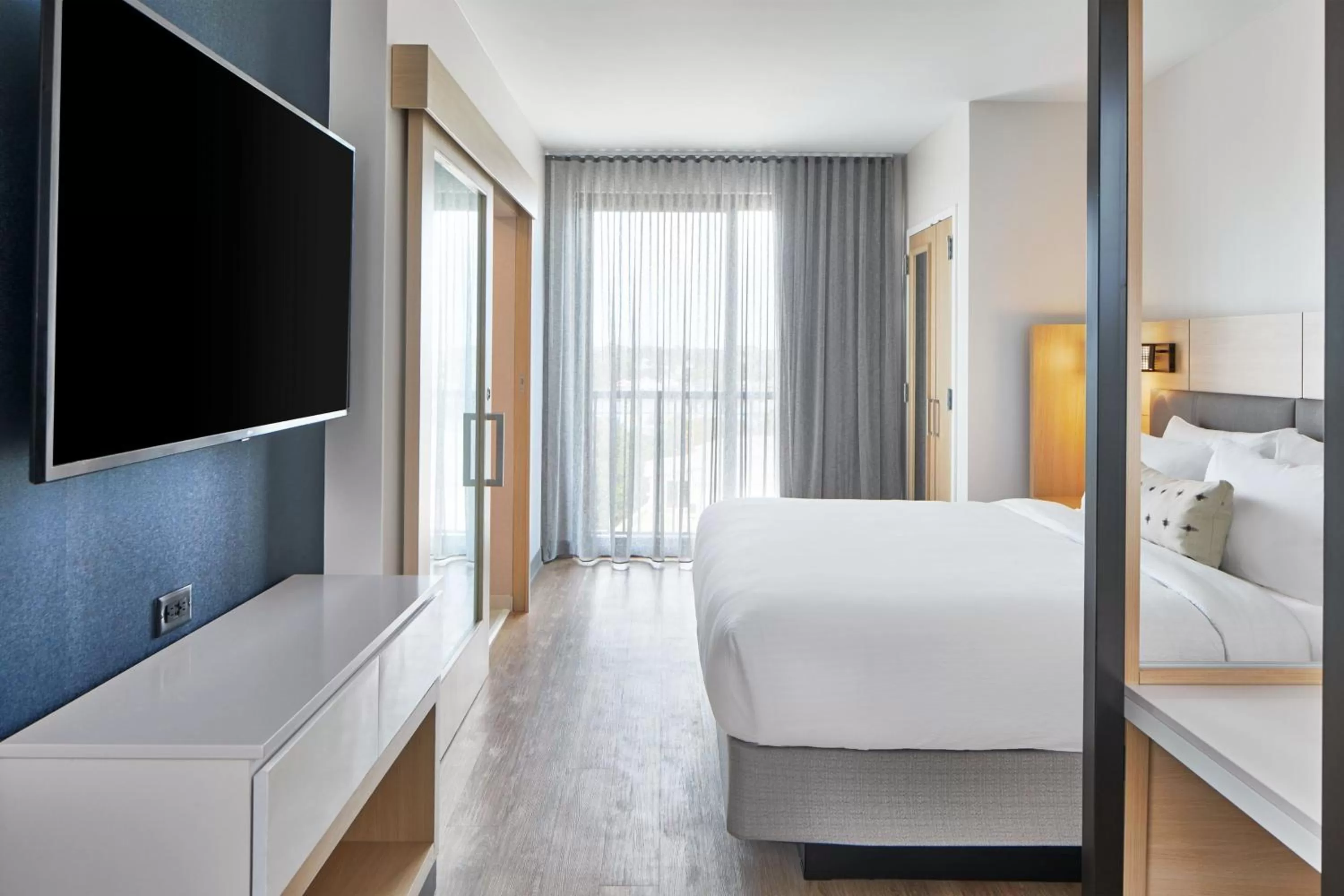 Photo of the whole room, Bed in SpringHill Suites by Marriott Jacksonville Beach Oceanfront