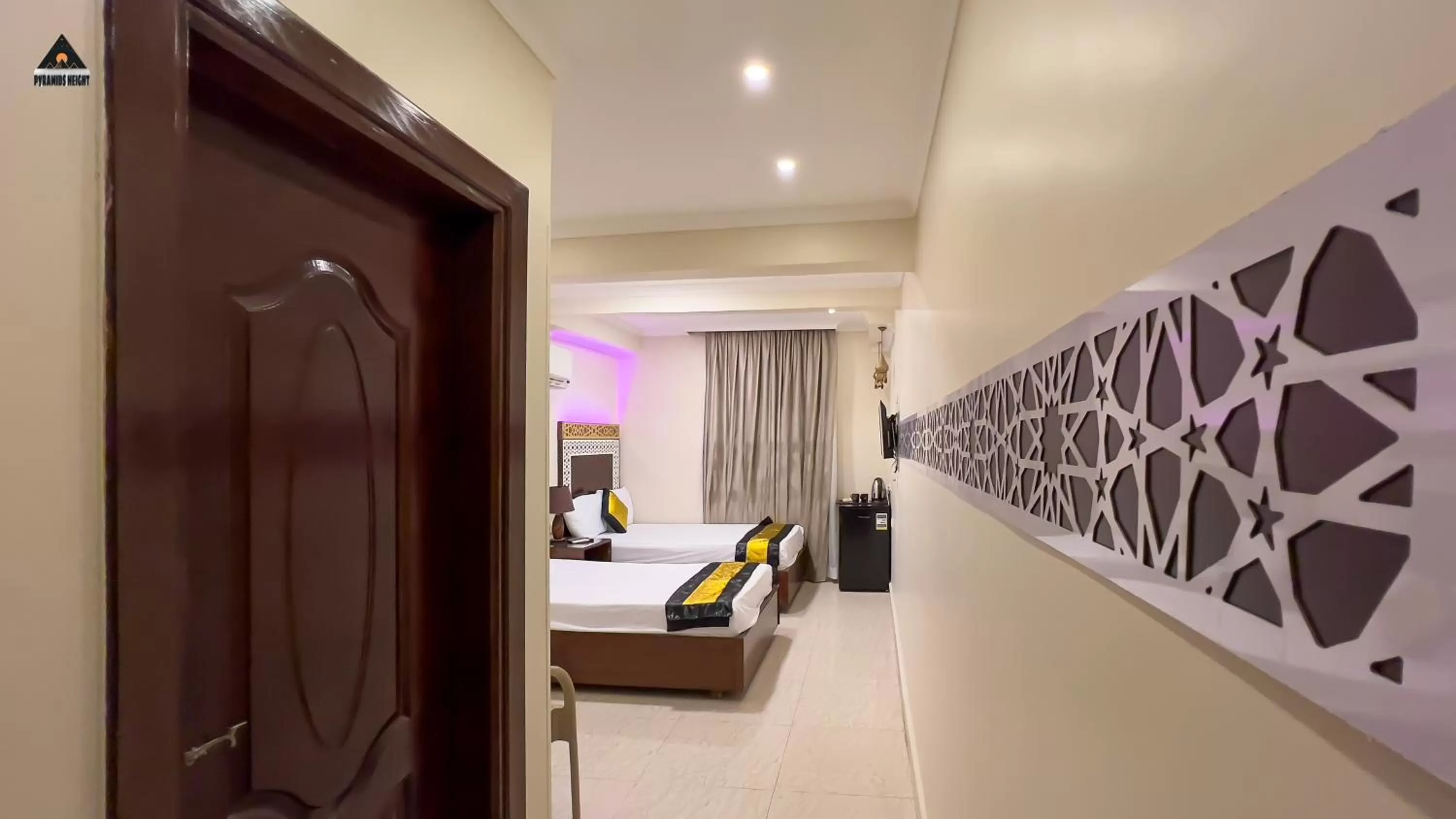 Bed in Pyramids Height Hotel & Pyramids Master Scene Rooftop