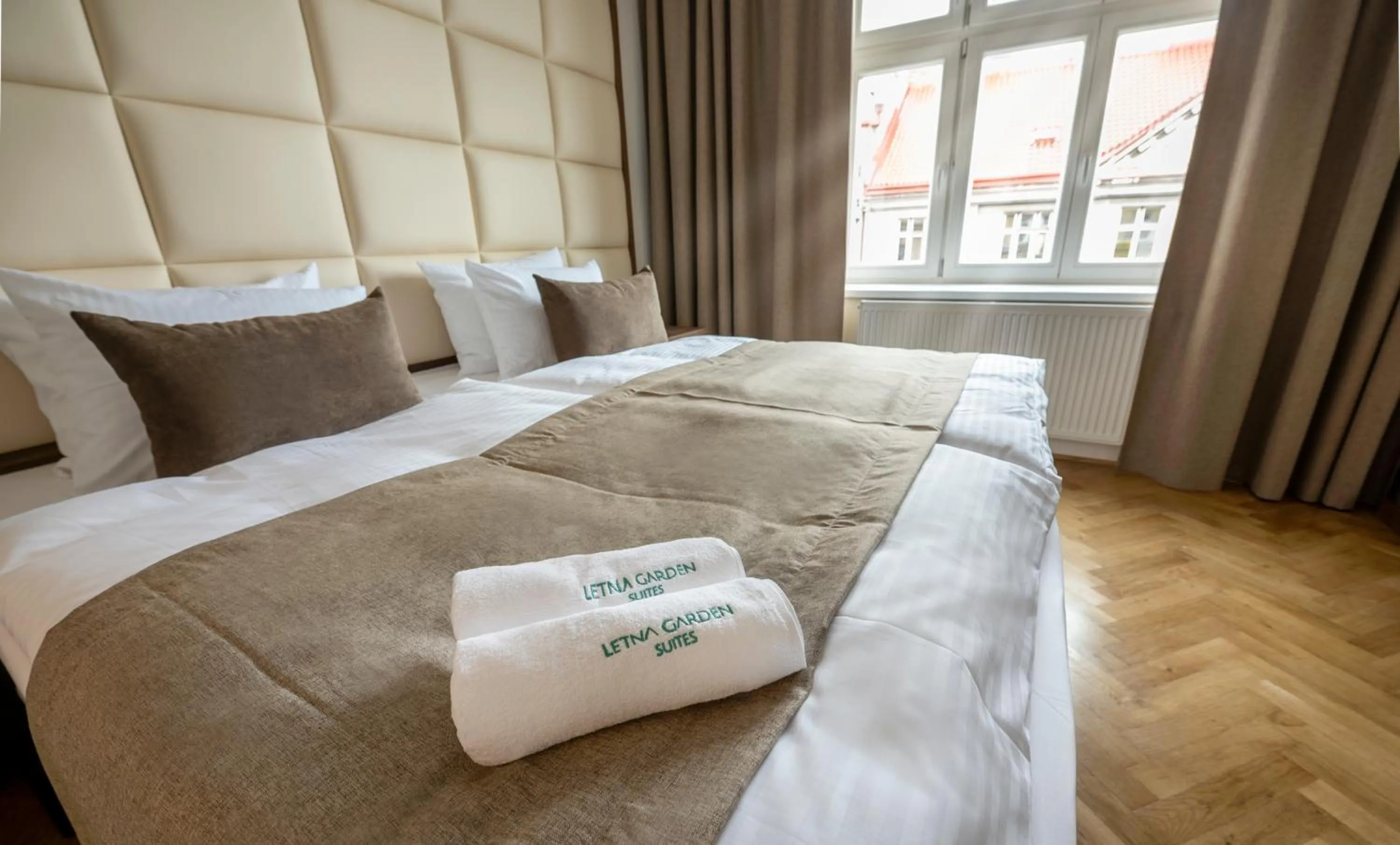 Bed in Letna Garden Suites