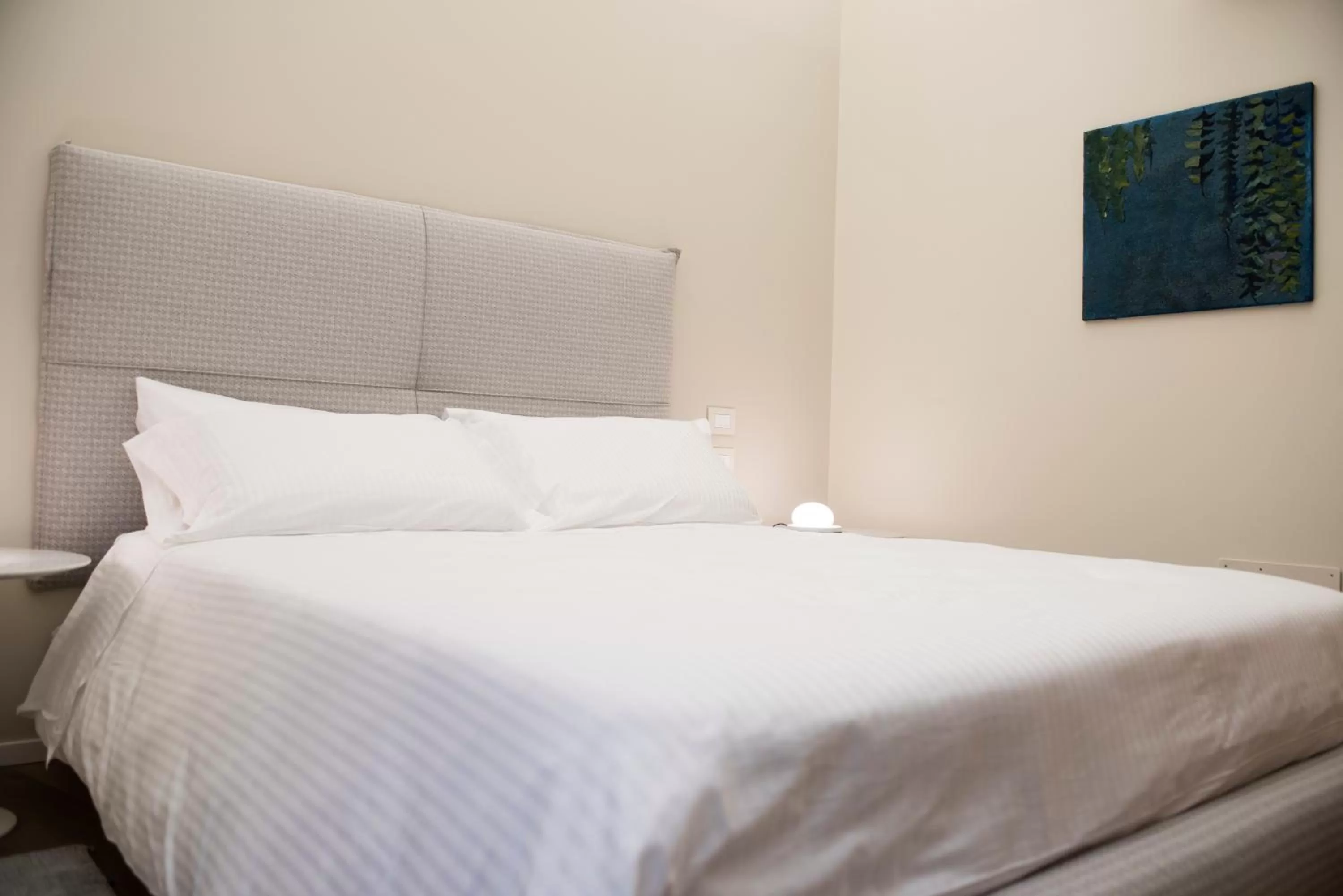 Bed in Dimora de Matera Luxury Suites