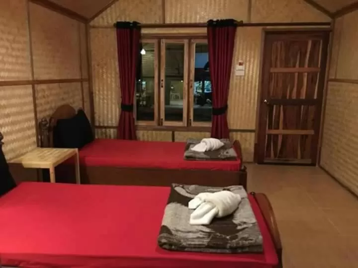 Bed in Bamboo House Resort