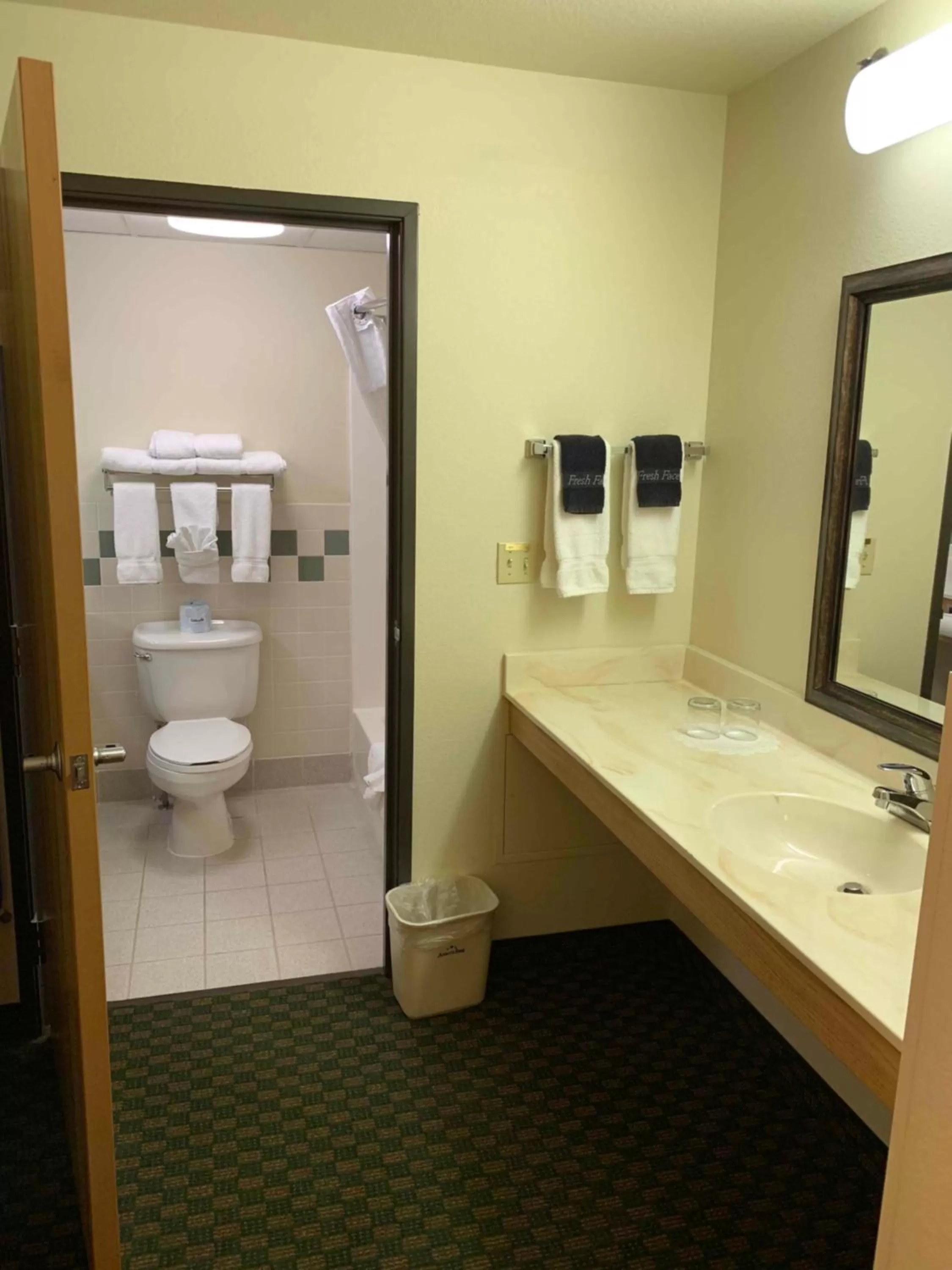 Bathroom in AmericInn by Wyndham Cody