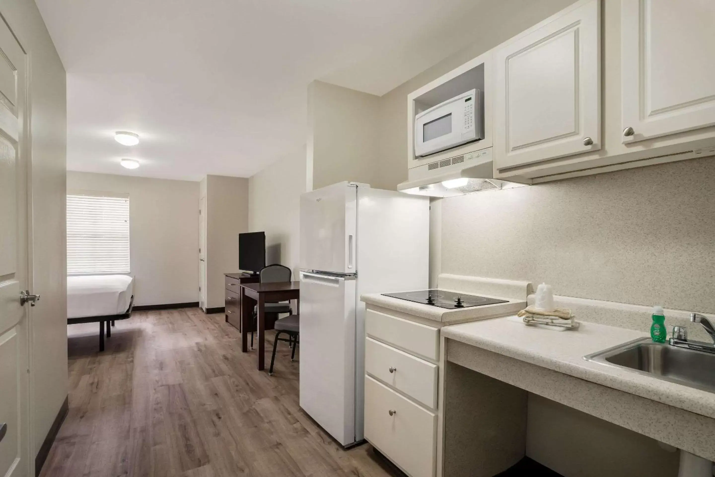 Bedroom, Kitchen/Kitchenette in Suburban Extended Stay Hotel Denver Central-Arvada