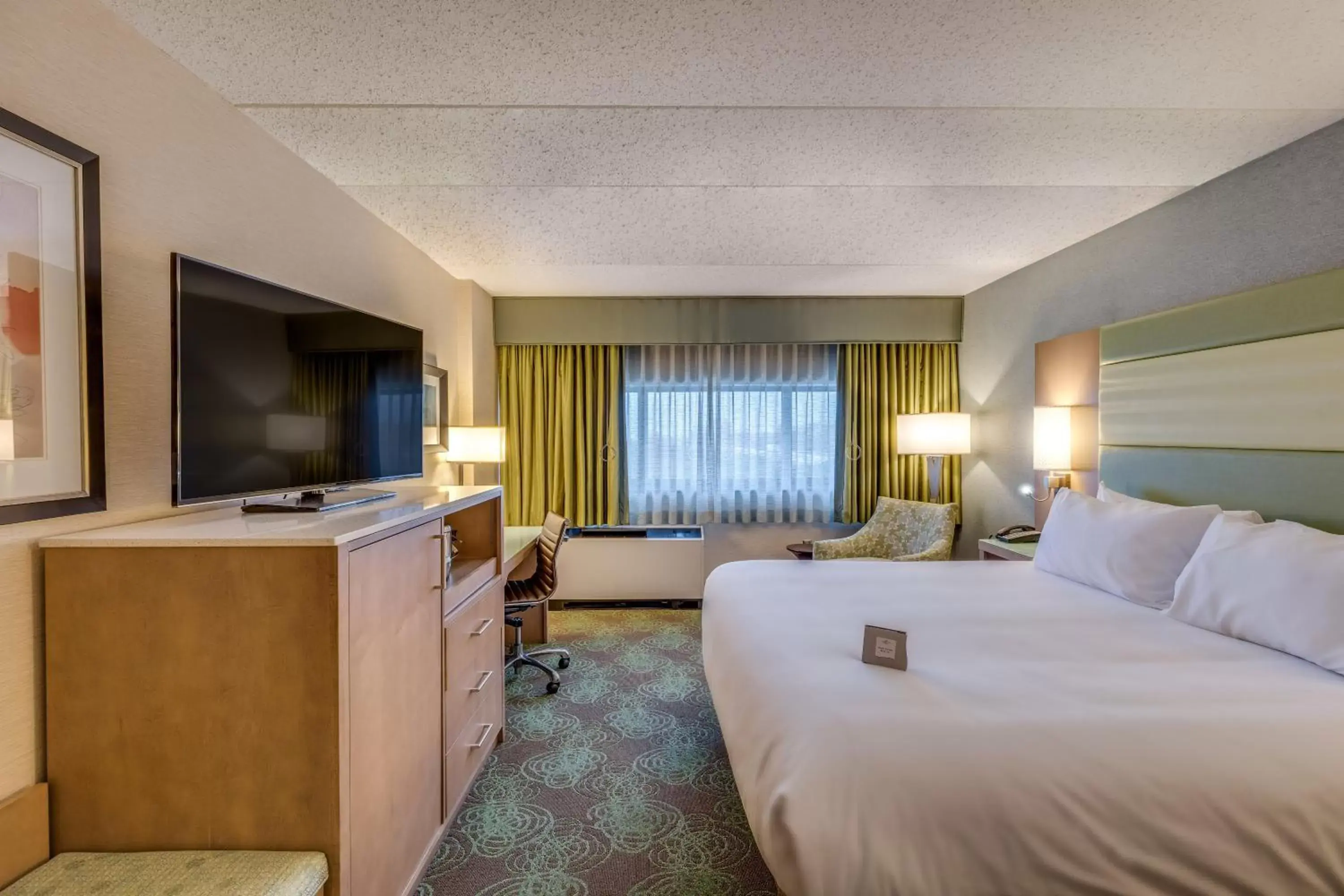 Photo of the whole room, TV/Entertainment Center in Crowne Plaza Lansing West, an IHG Hotel