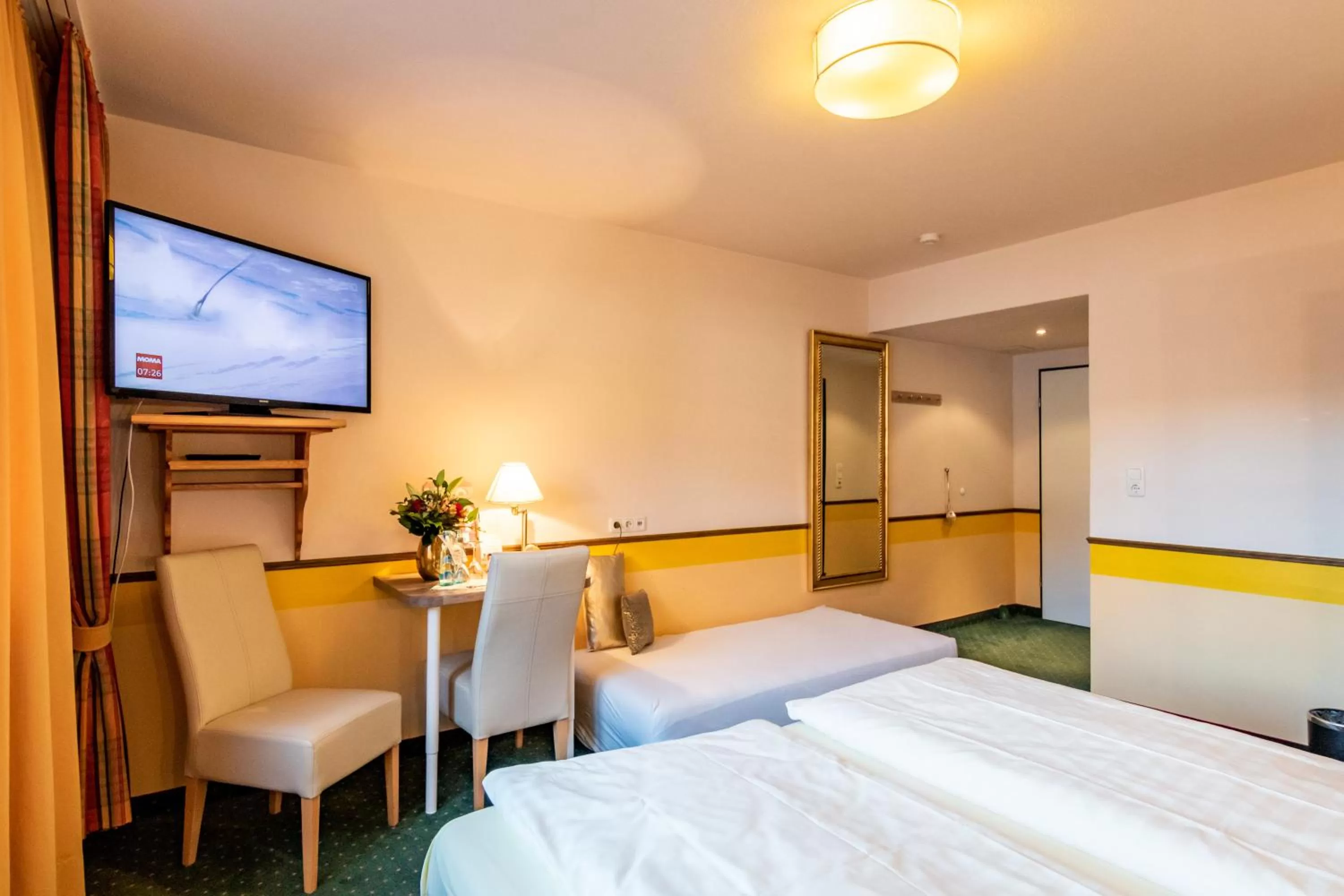 Photo of the whole room, Bed in Hotel Goldflair am Rathaus