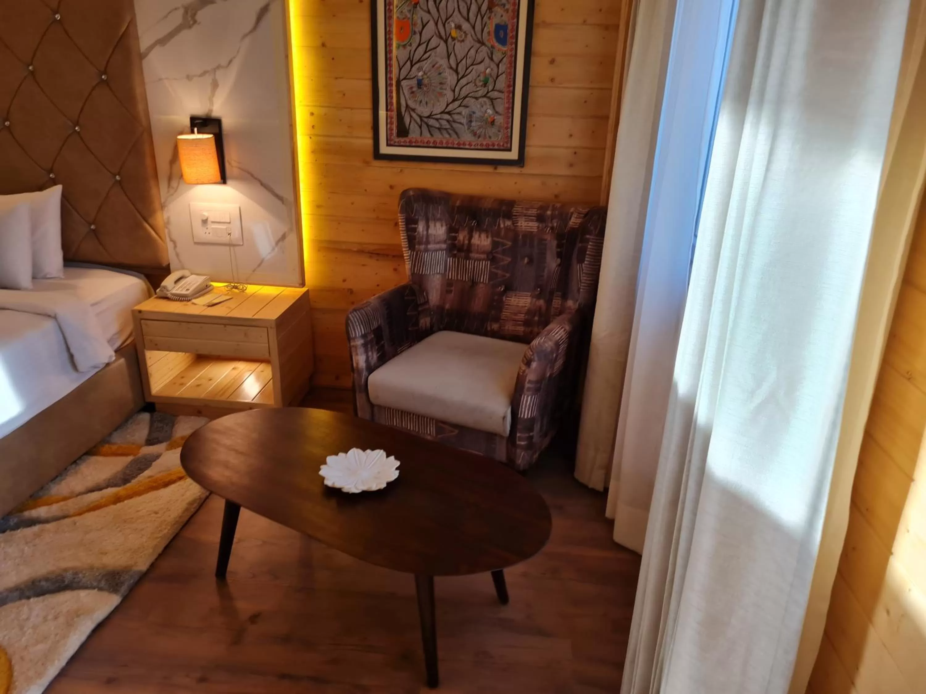 Seating area, Bed in Bamboo Saa Resort & Spa - Udaipur