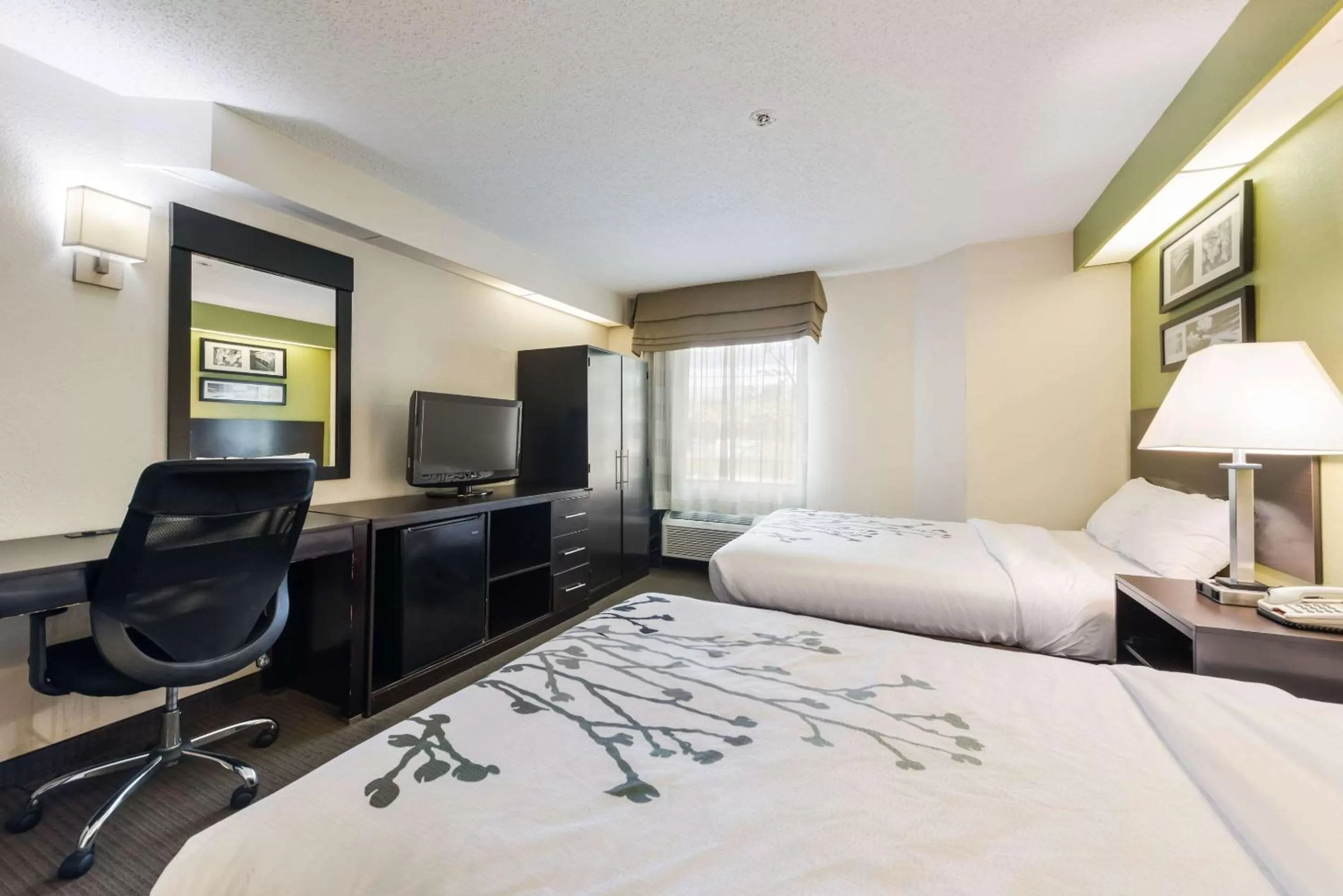 Photo of the whole room, TV/Entertainment Center in Rodeway Inn